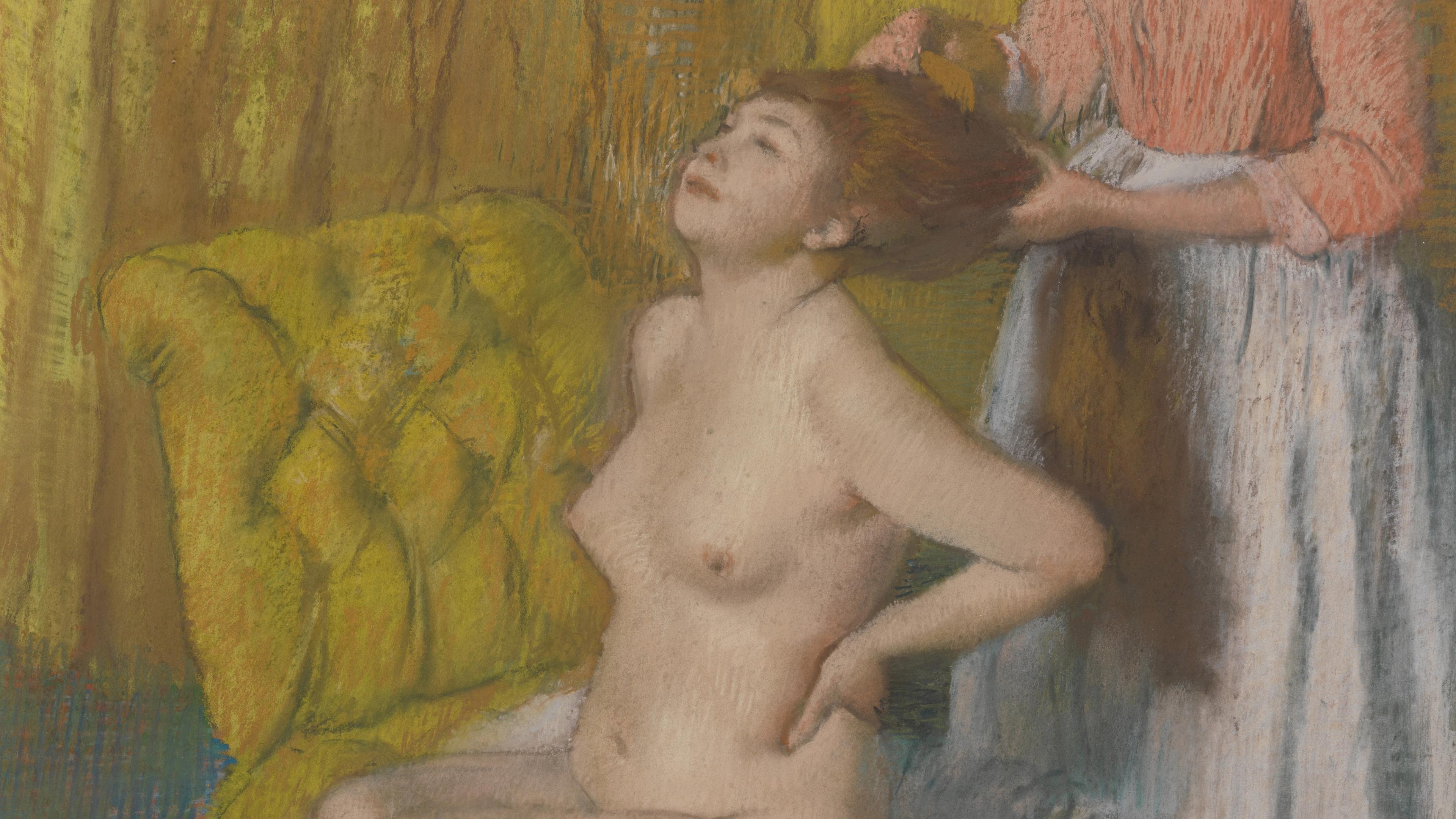 A seated, nude woman having her hair combed