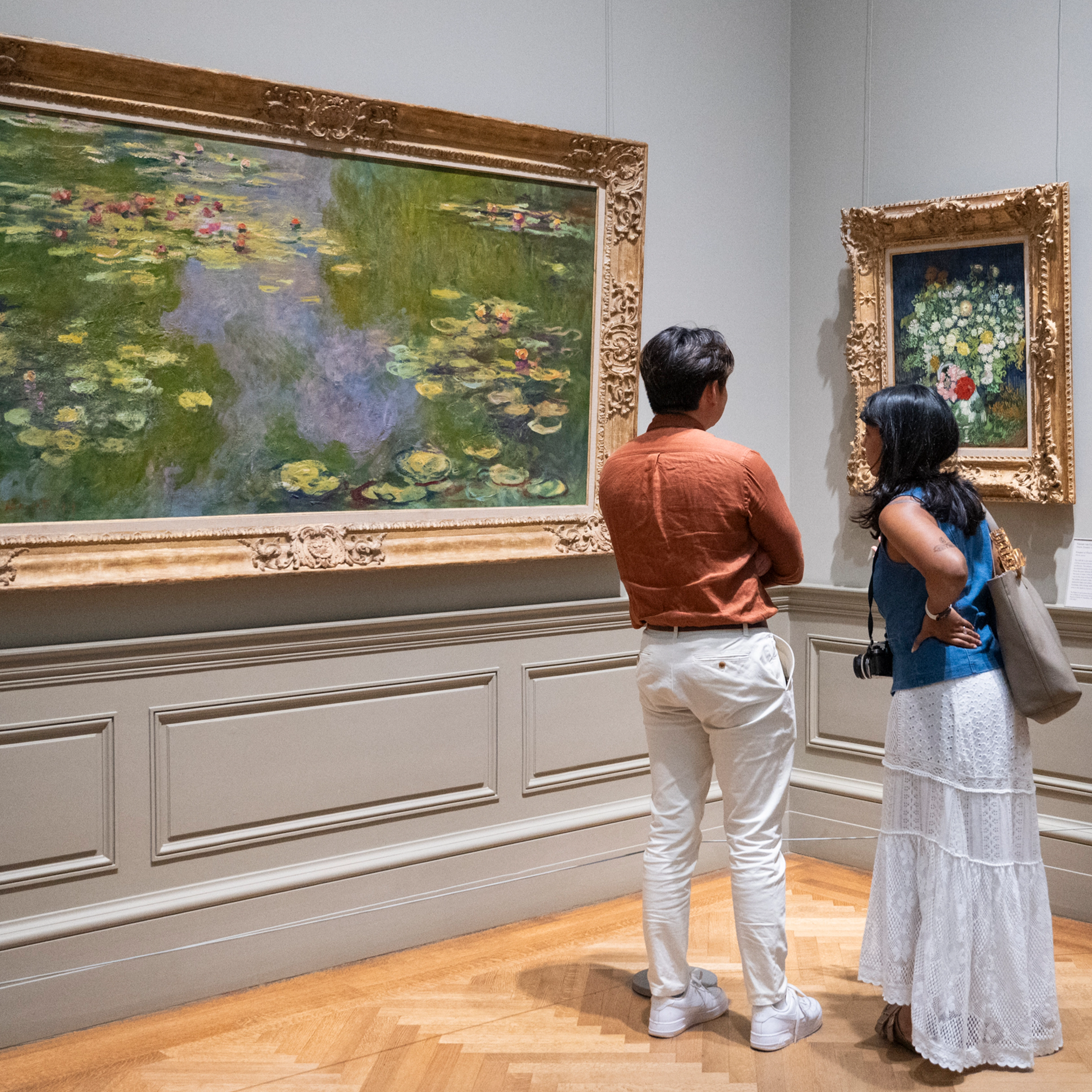 Two people in the European Paintings galleries at The Metropolitan Museum of Art. 