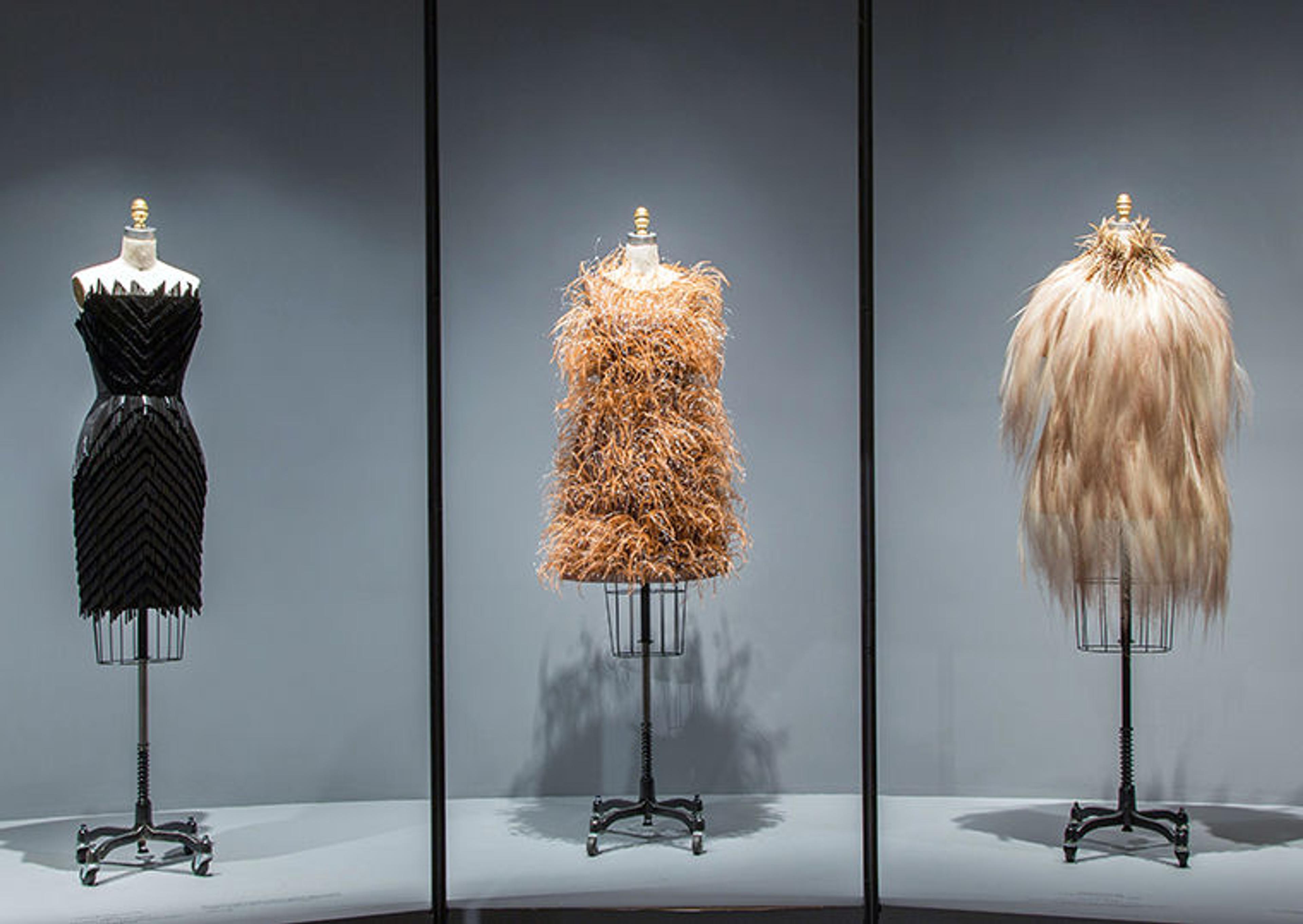 An evening dress by Hubert de Givenchy (center) in Manus x Machina: Fashion in an Age of Technology