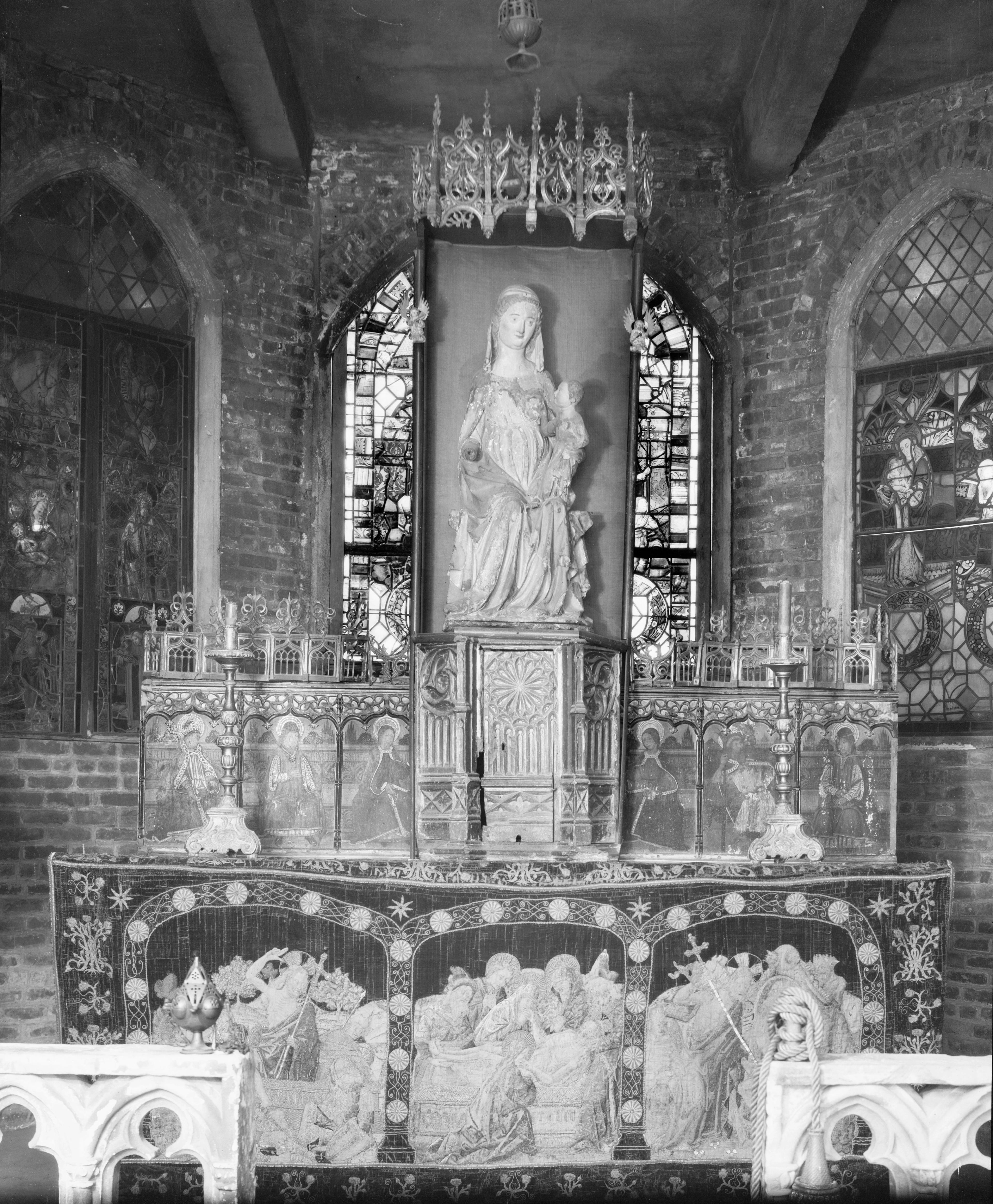 Black-and-white photo of a highly decorated shrine.