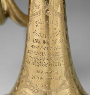 Left: The cornet's bell, engraved with Missenharter's name and accolades