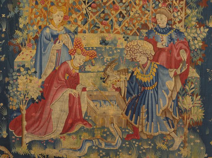 A man and woman, along with their attendants, are in the center of a tapestry on either side of a basin of water