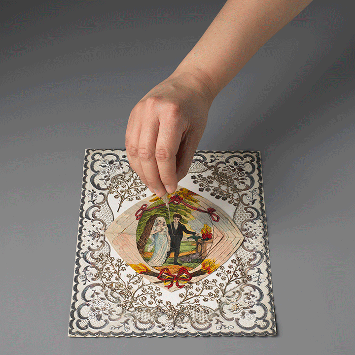 Animated image of cobweb valentine being pulled by its string.