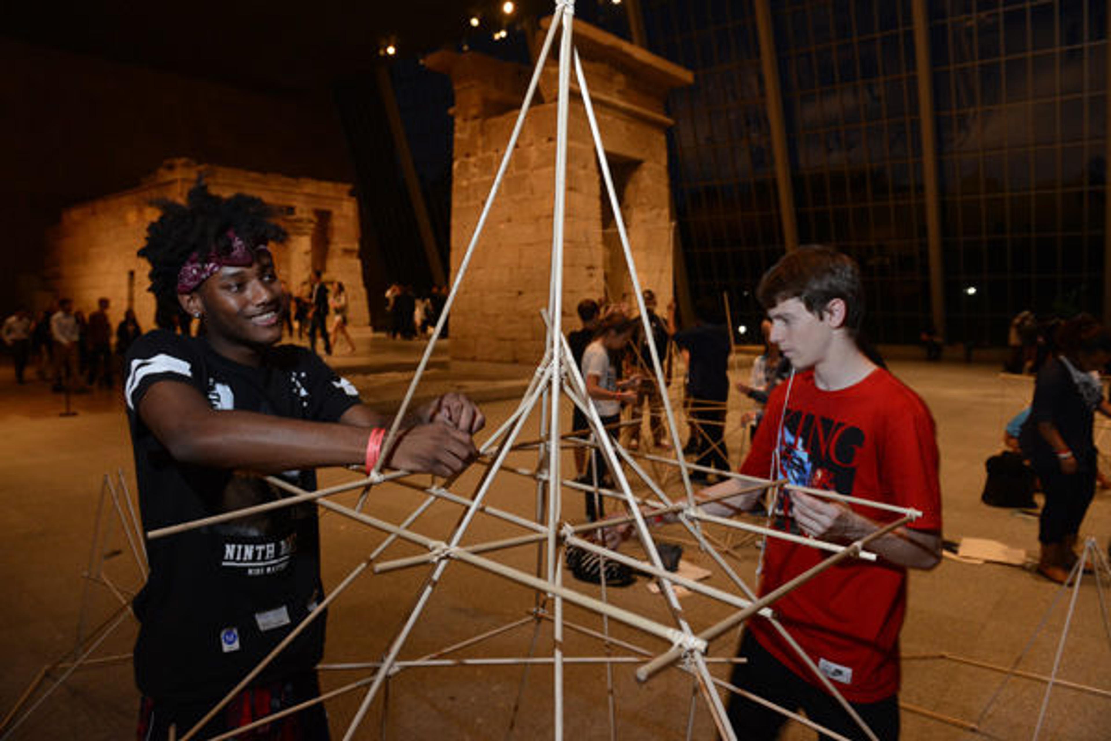 Teens collaborating in the Temple of Dendur