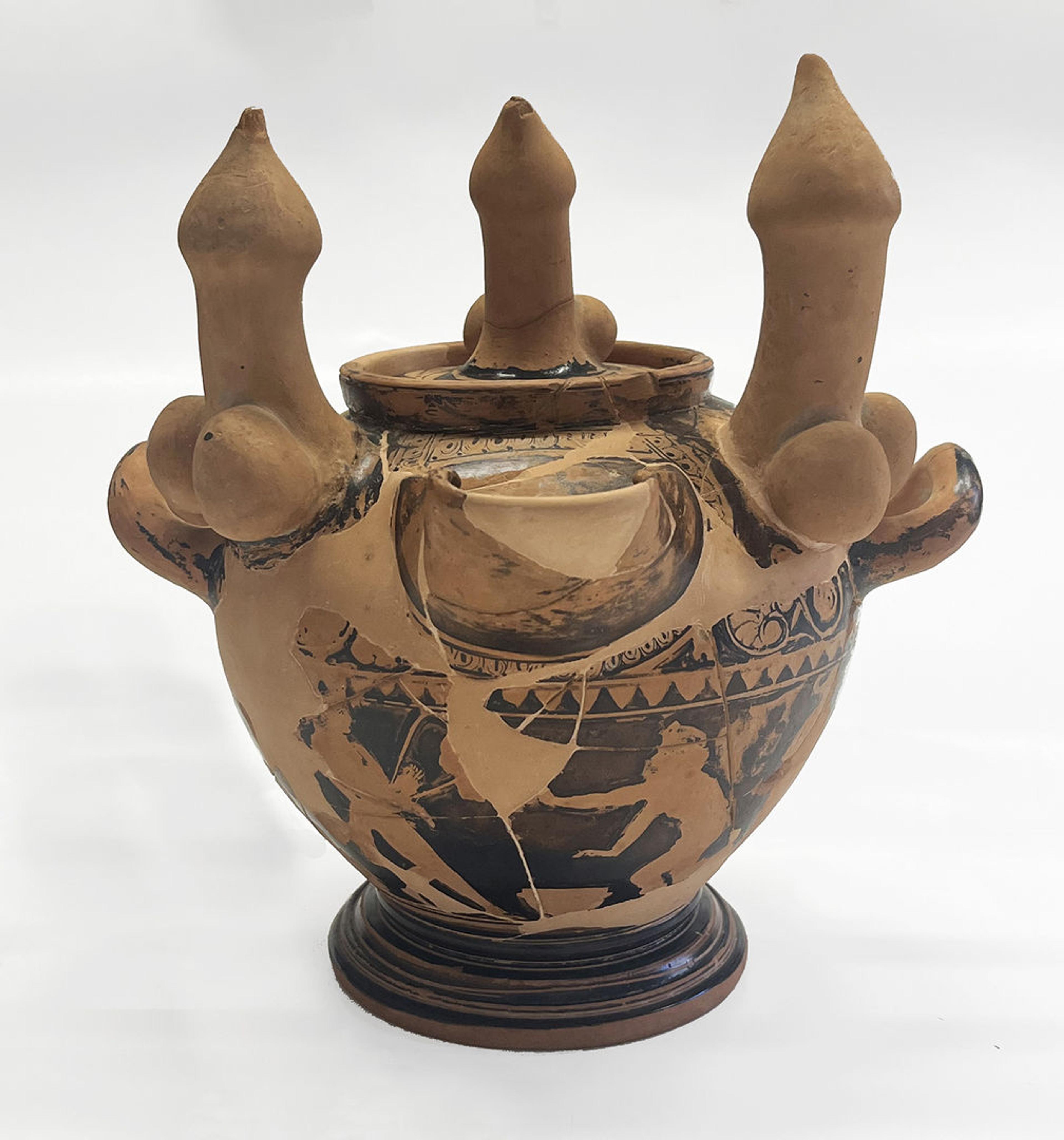 Vase in shades of brown with erotic scenes around the bowl. Three sculpted erect phalluses adorn the top.