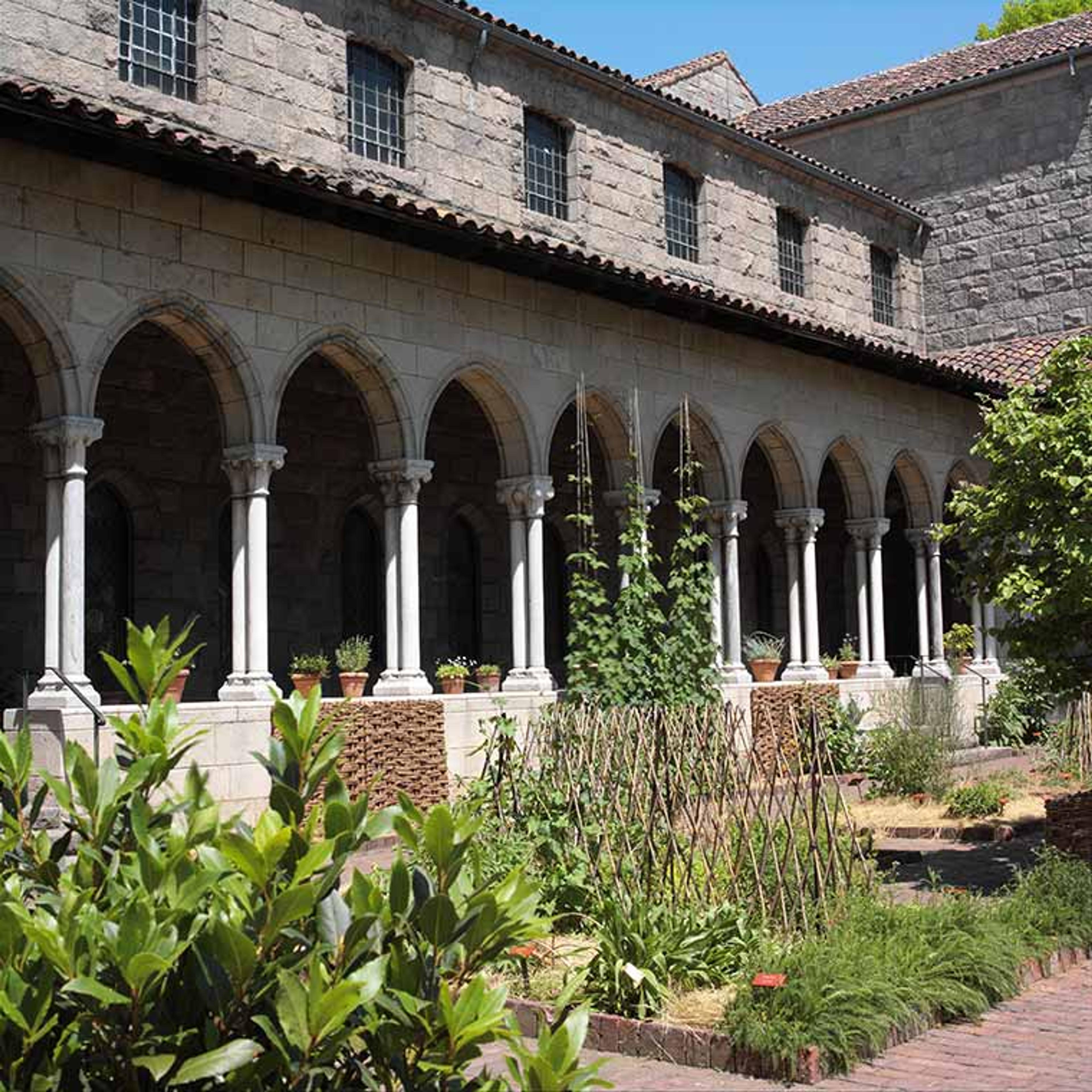 The cloister's L-shaped arcade screens the herb garden, which is modeled after medieval times.