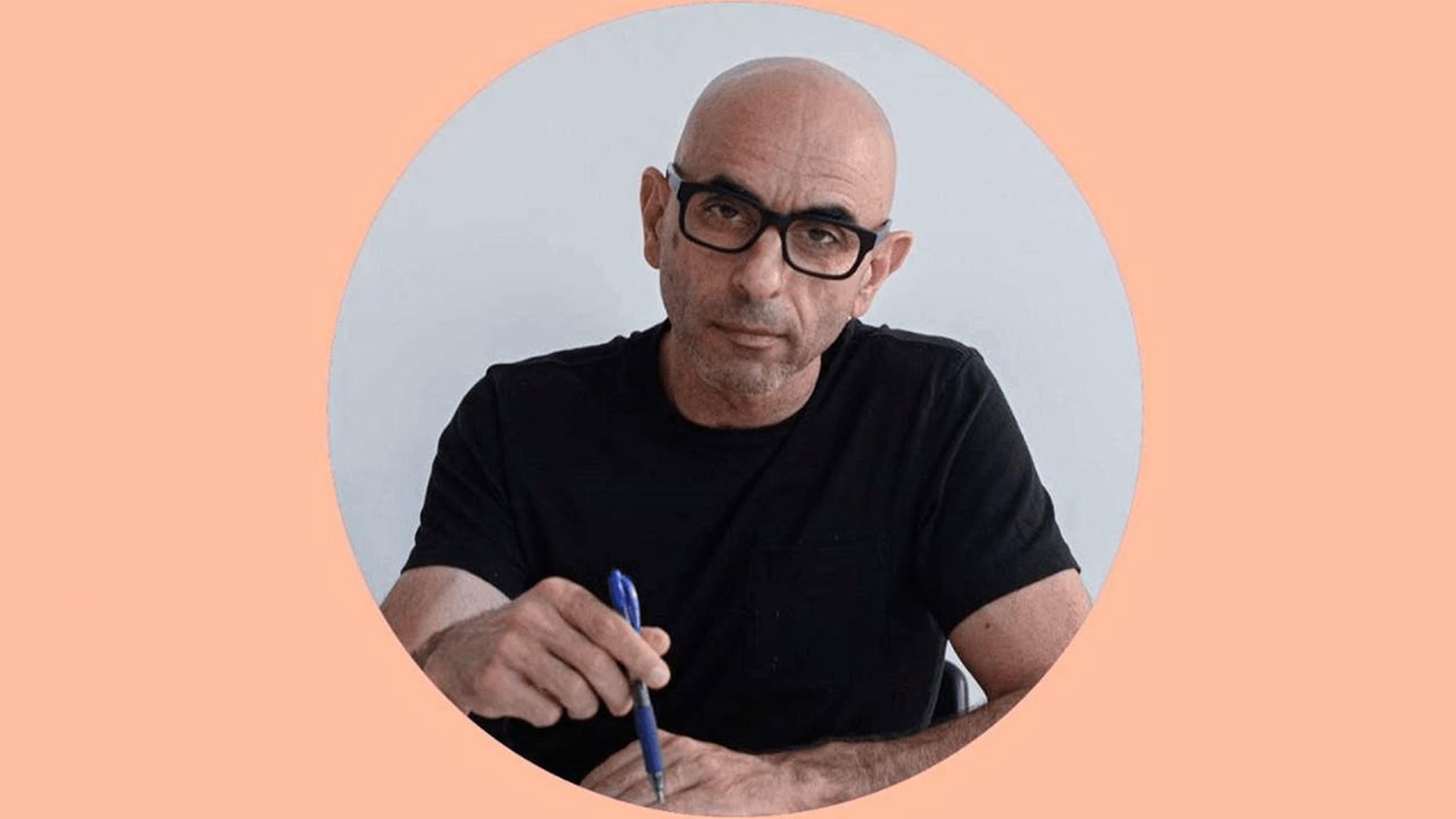 Circular cropped photograph of architect Nader Tehrani against a peach background