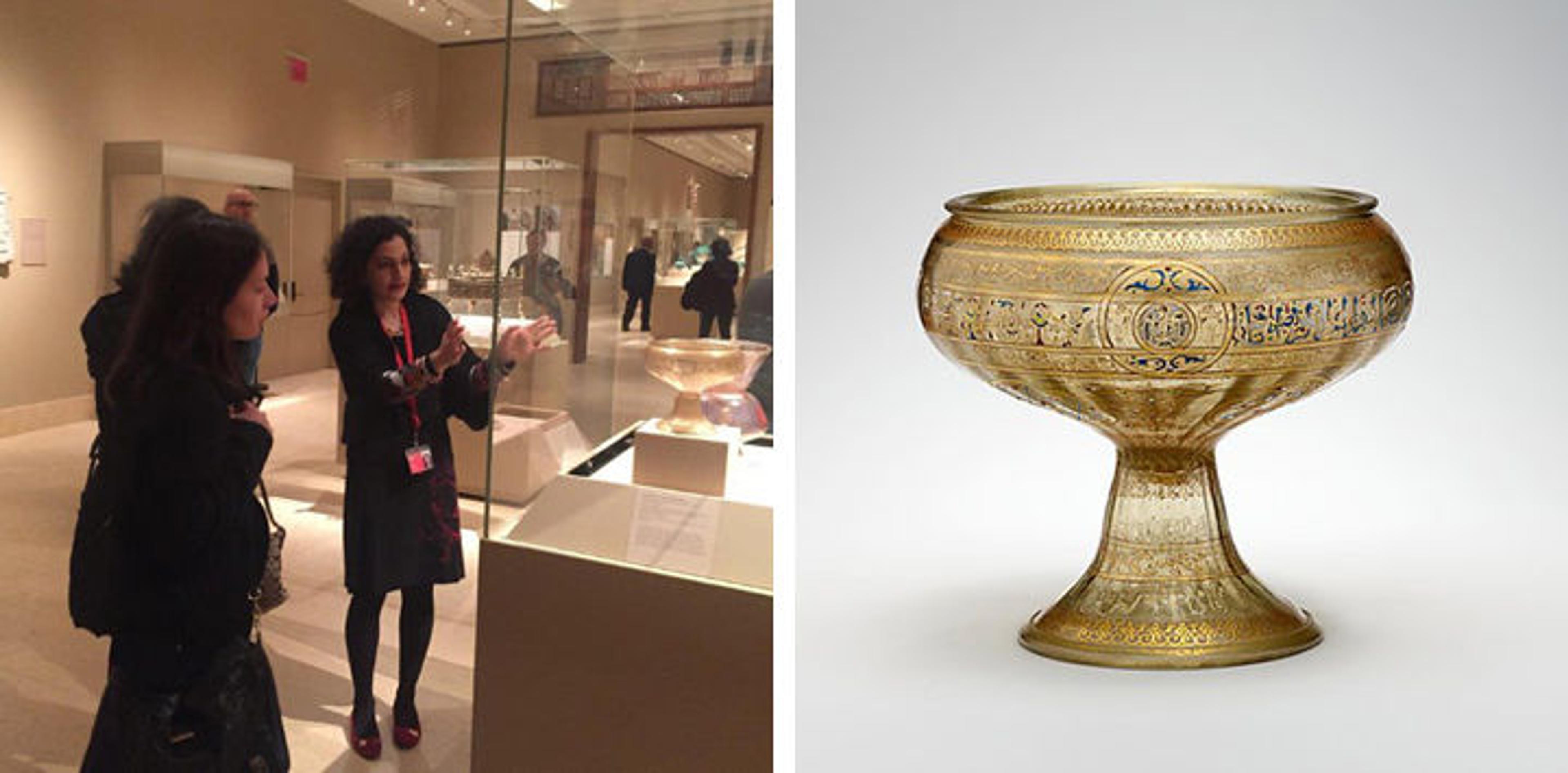 Curator discussing 13th-century glass vessel with visitor; image of vessel