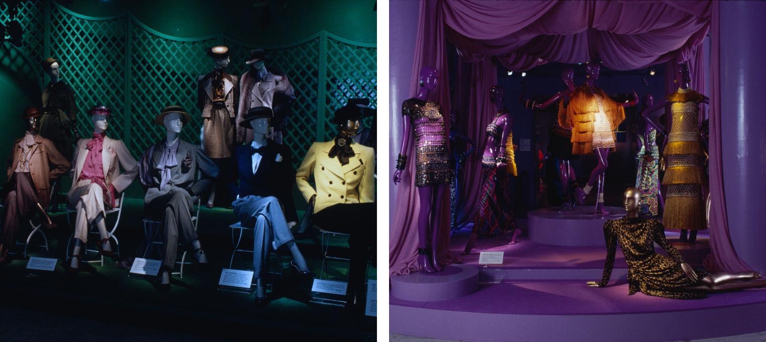 A row of mannequins dressed with trousers, suits, and hats next to a variety of garments featuring beads, shells and prints