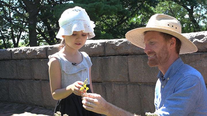 Ella and Caleb Leech with flowers at The Cloisters