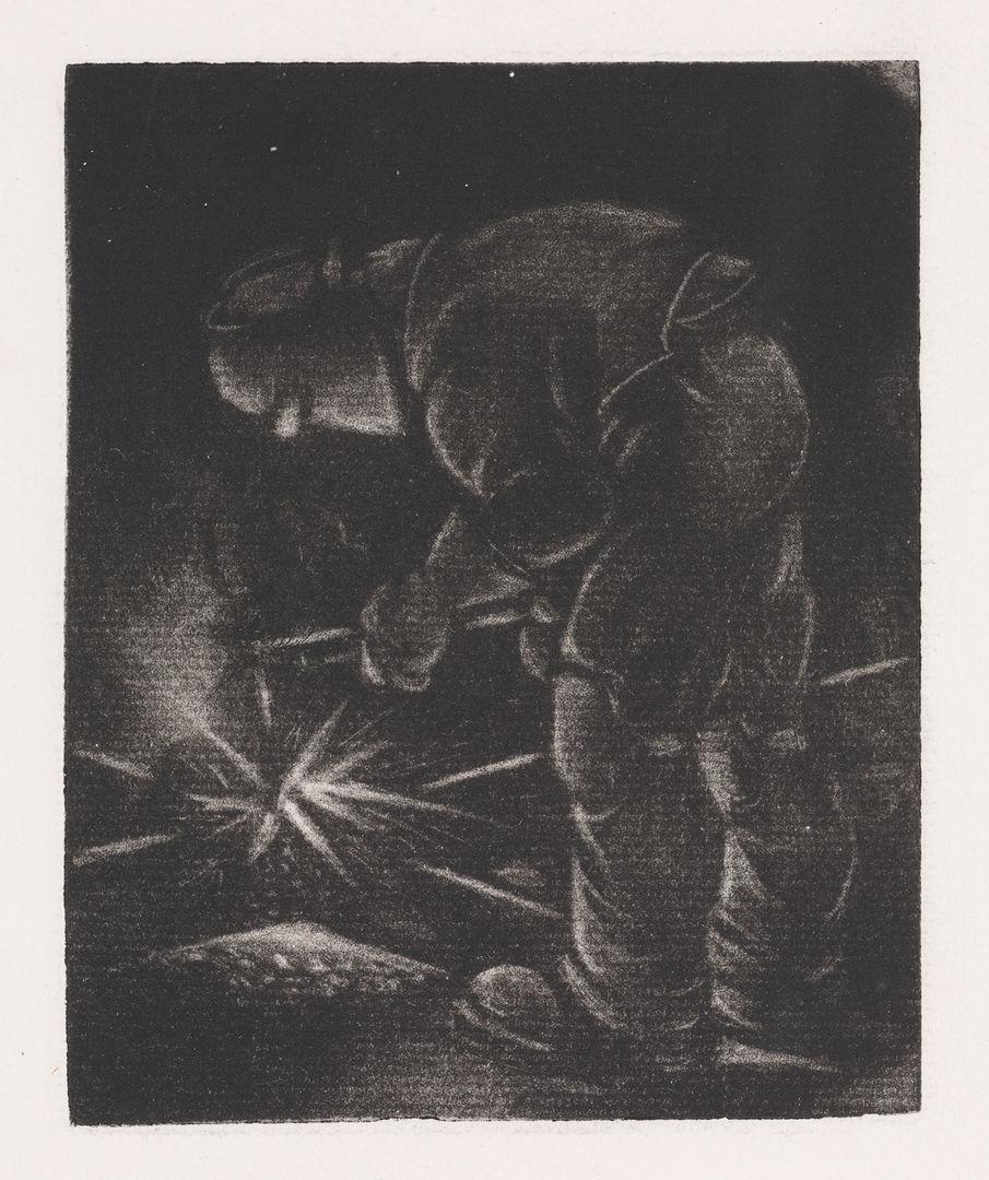 African American welder welding metal together.