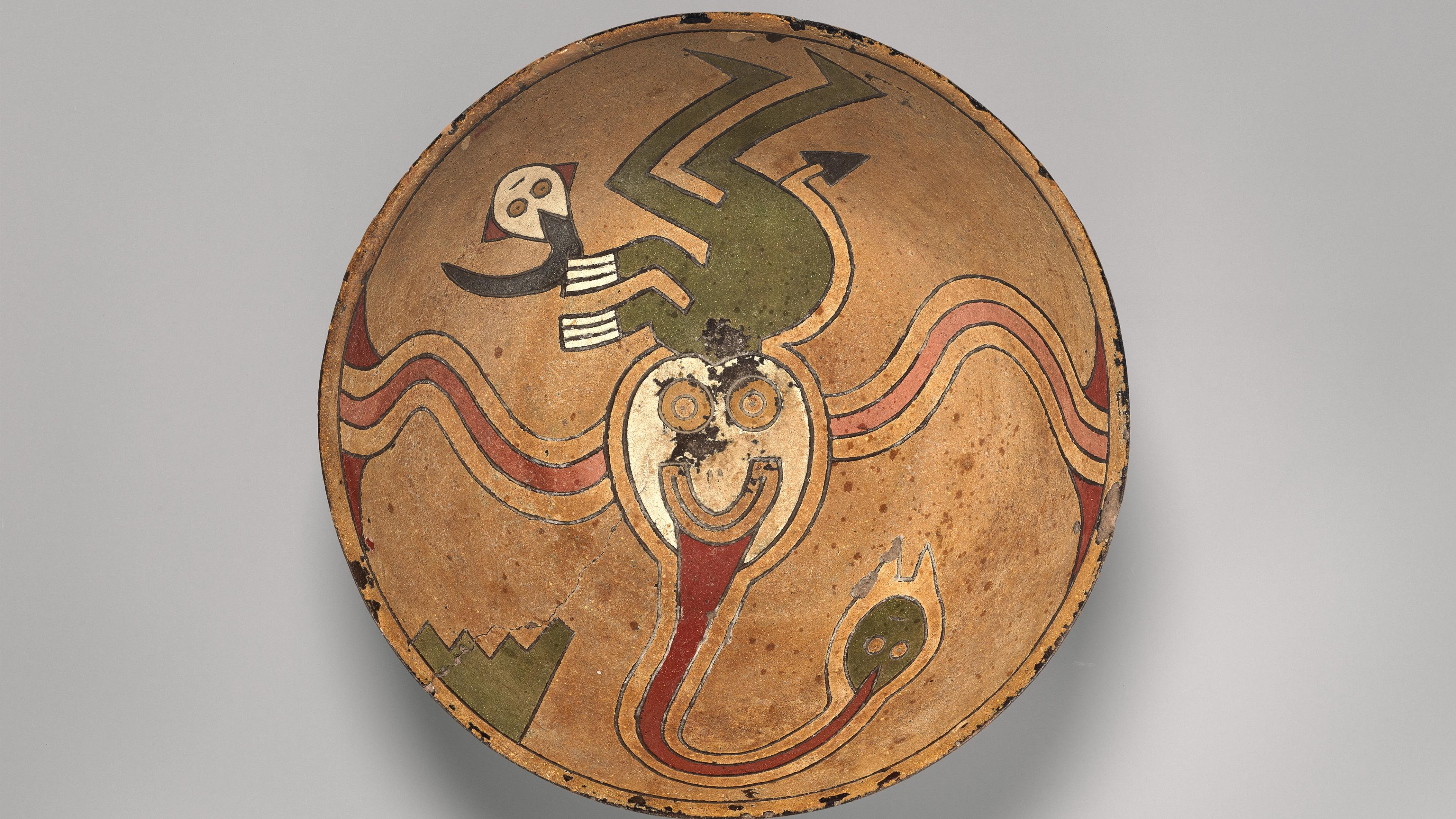 Ceramic rattle bowl with flying figure painted on the inside