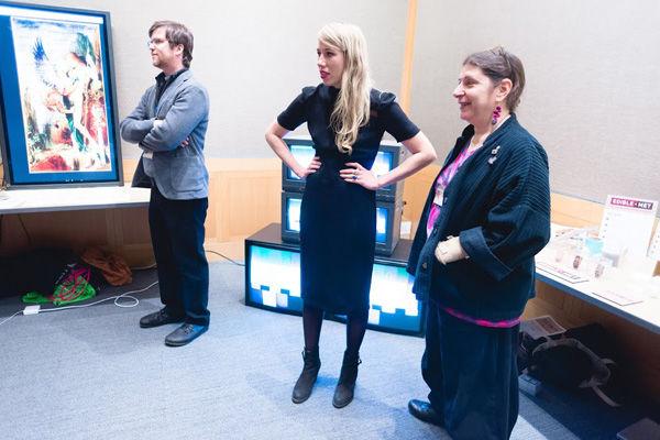 Joselyn McDonald (FEMET artist) standing with Robin Schwalb from the Metropolitan Museum of Art’s Digital Art Department standing in front of FEMET. Robin Schwalb and Jessica Glass were instrumental in retrieving and networking archival equipment for the installation.