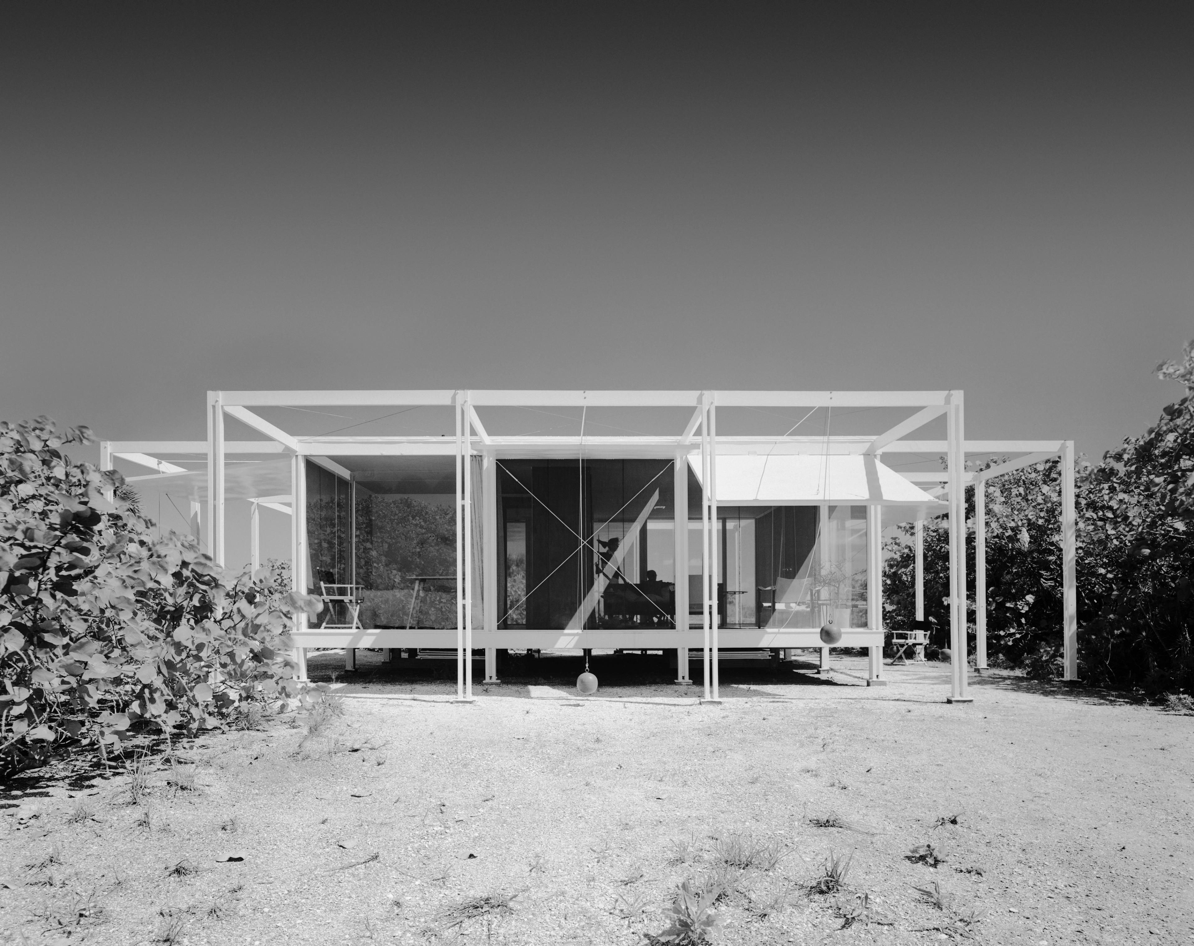 Black and white image of a unique designed home.