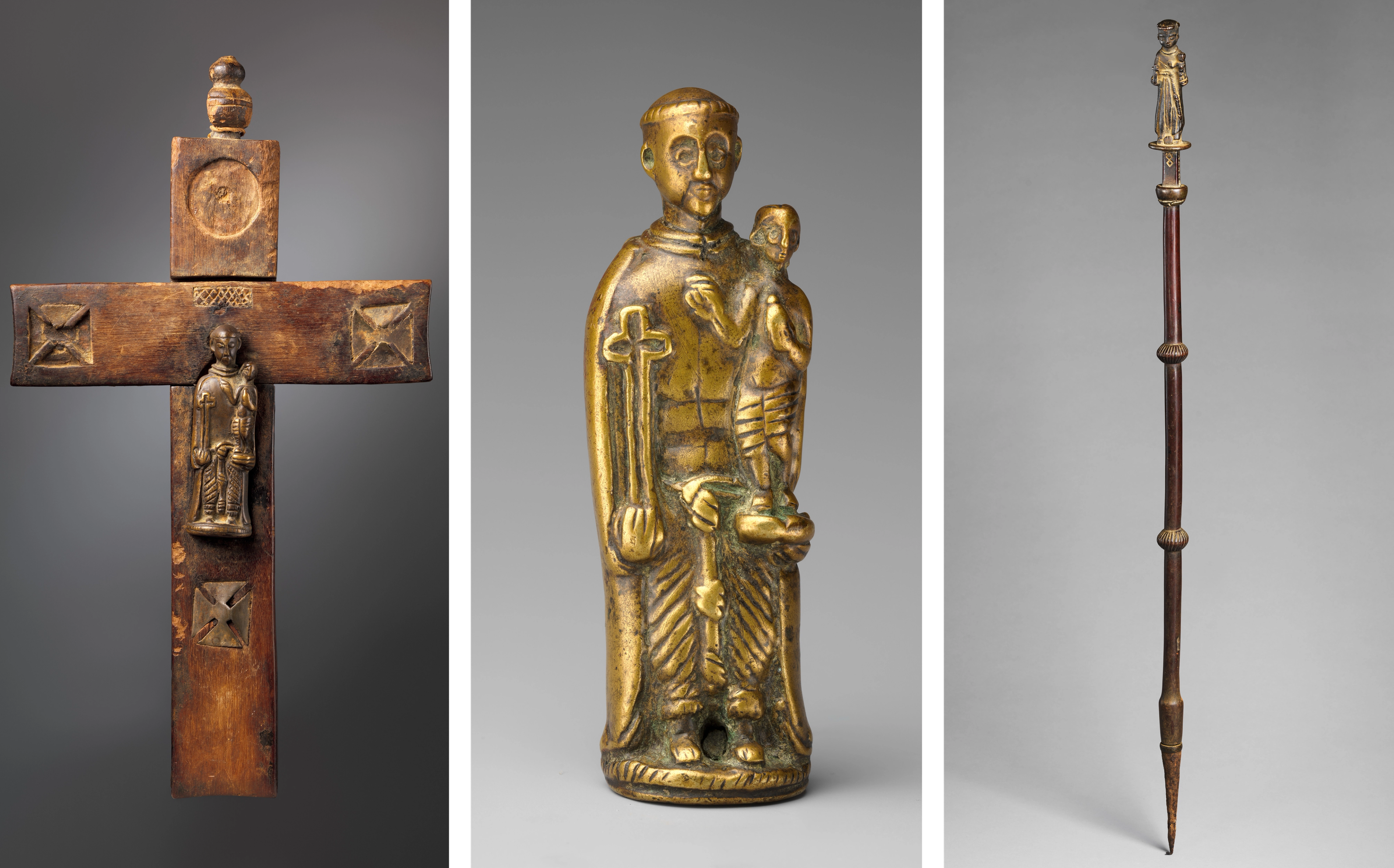 Brass figures of Saint Anthony of Padua represented on a crucifix, as a pendant, and at the top of a staff.