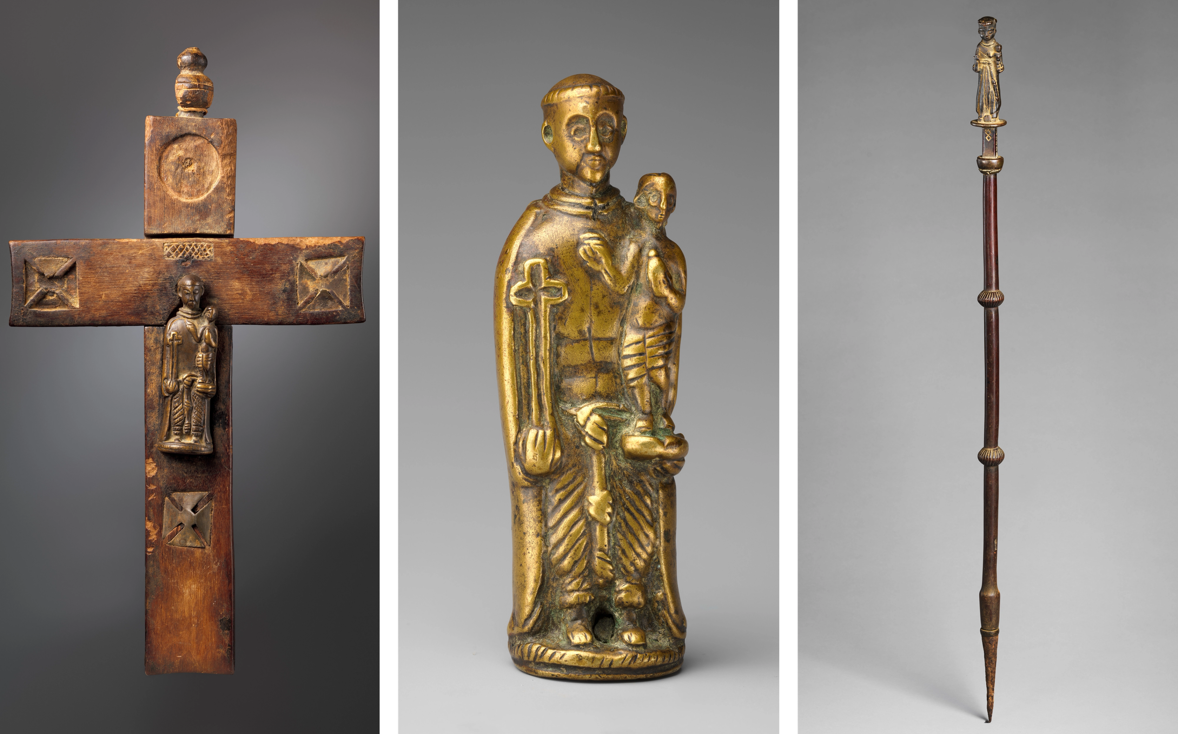 Brass figures of Saint Anthony of Padua represented on a crucifix, as a pendant, and at the top of a staff.