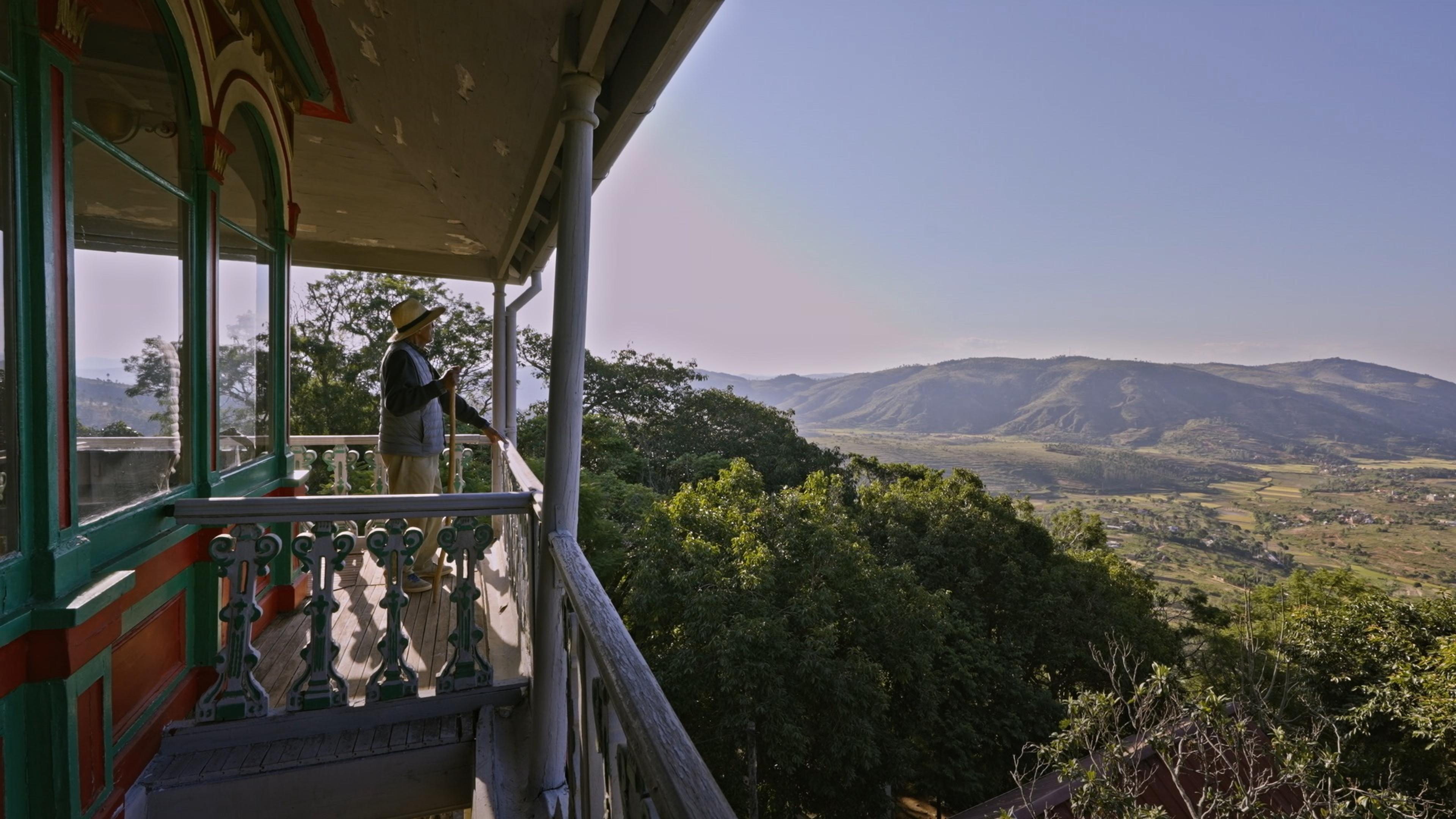 (Man) overlooking the Royal Hill of Ambohimange in Madagascar