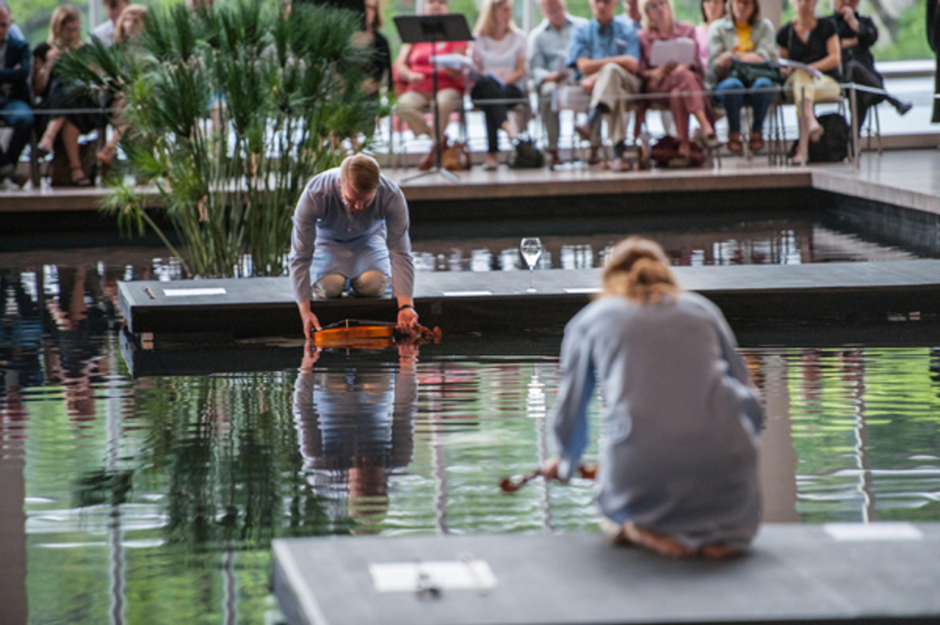 Alarm Will Sound performs Kate Soper's I Was Here I Was I at The Temple of Dendur in The Sackler Wing. Photo by Stephanie Berger
