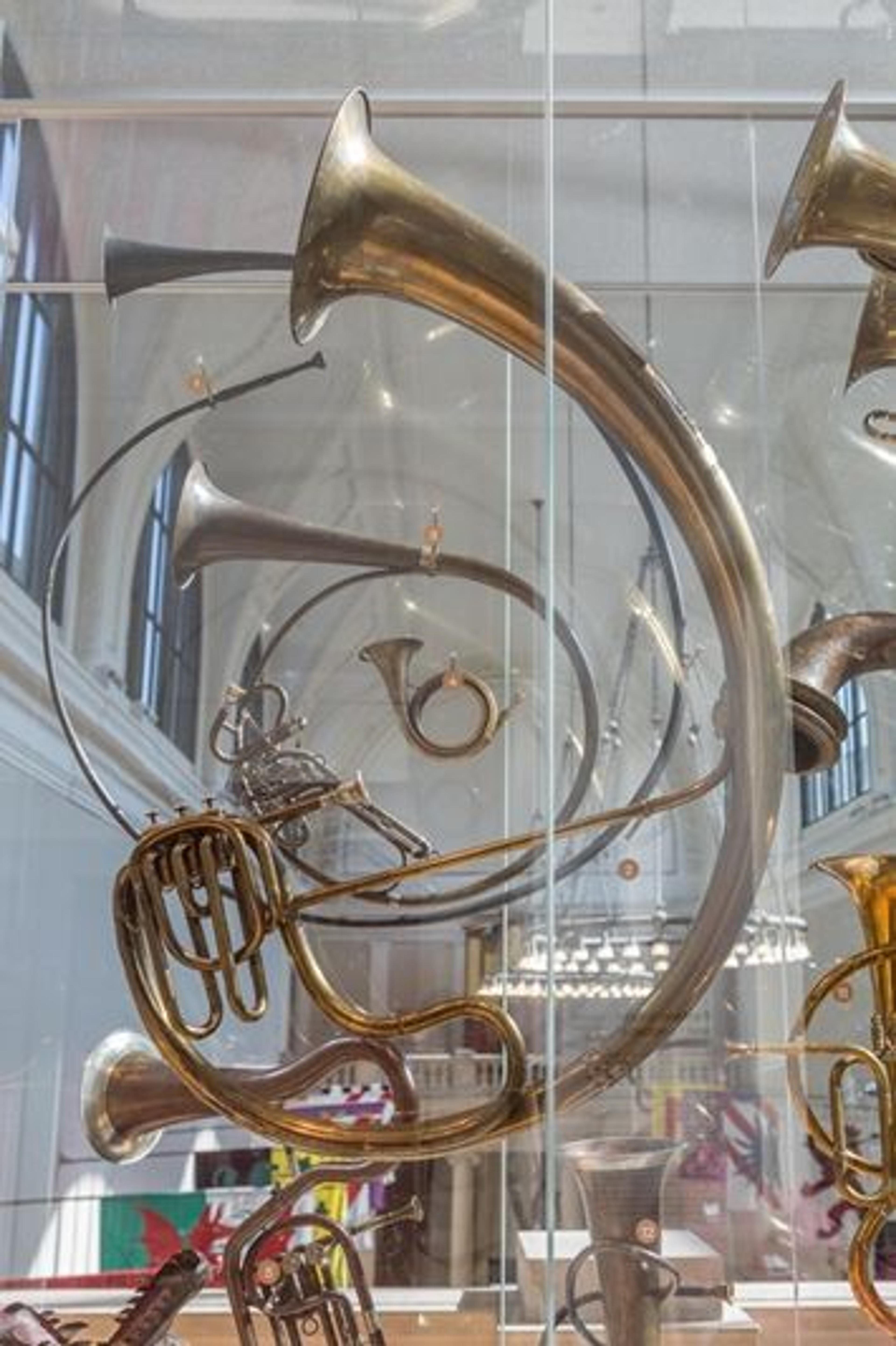 Side view of the large display of brass instruments featured in Fanfare