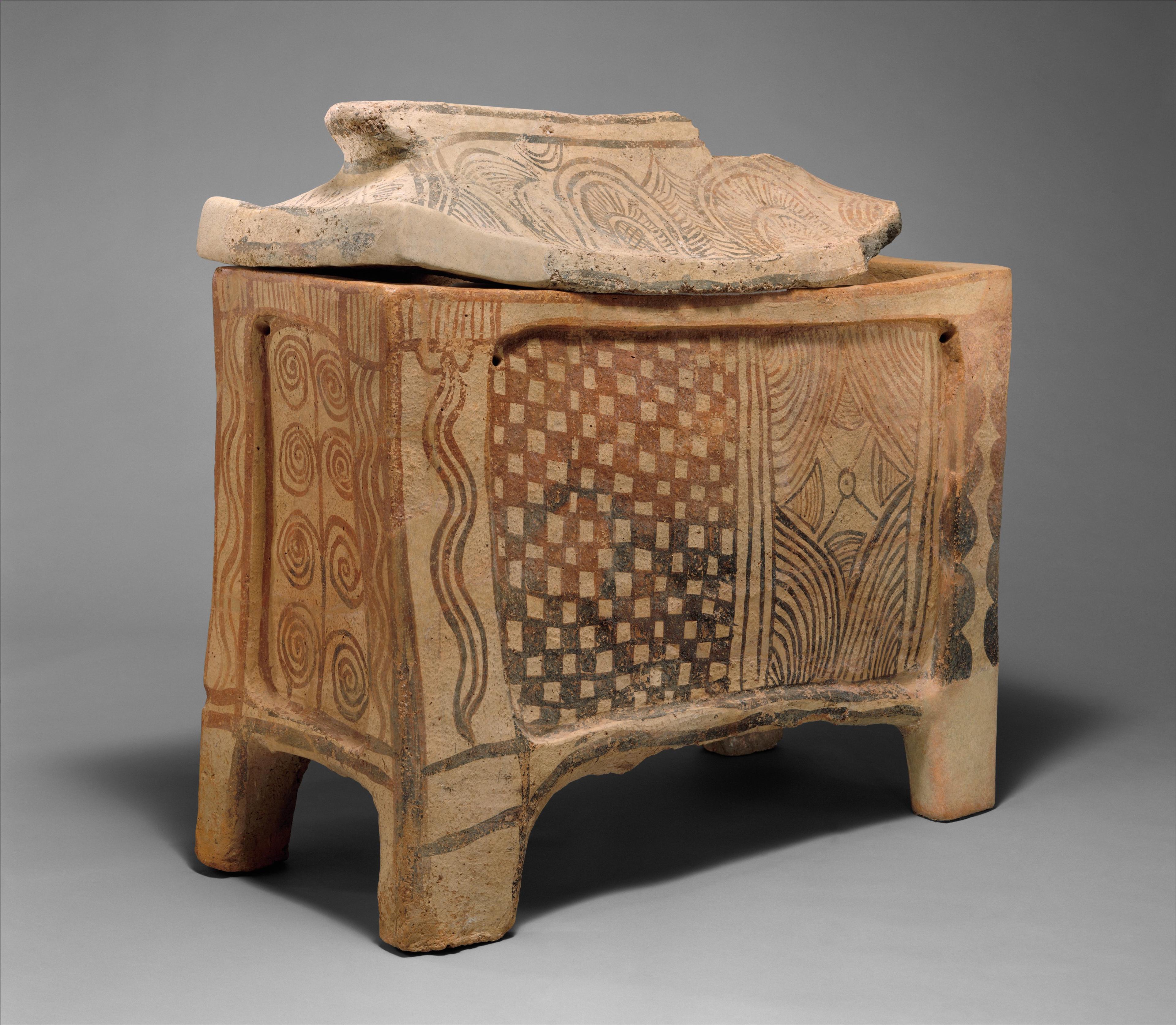 Terracotta larnax (chest-shaped coffin) with decoration on each side consisting of geometric and vegetal ornaments.