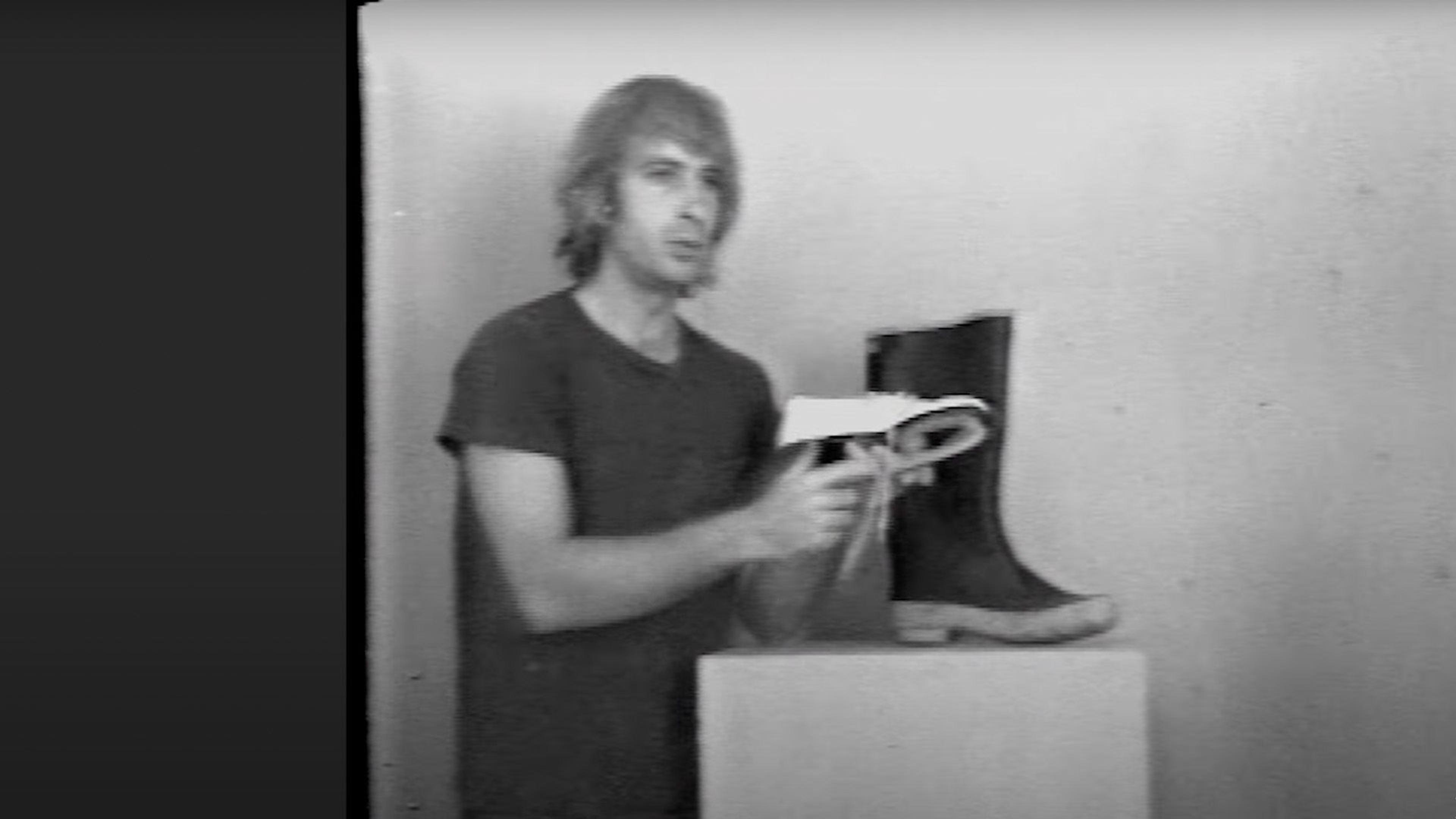 Artist William Wegman holds an ice skate.