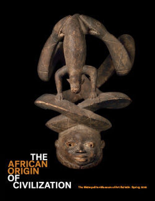 a wood sculpture features an animal (a pangolin) suspended between two serpents above a head; the name of the publication is below in white and red type