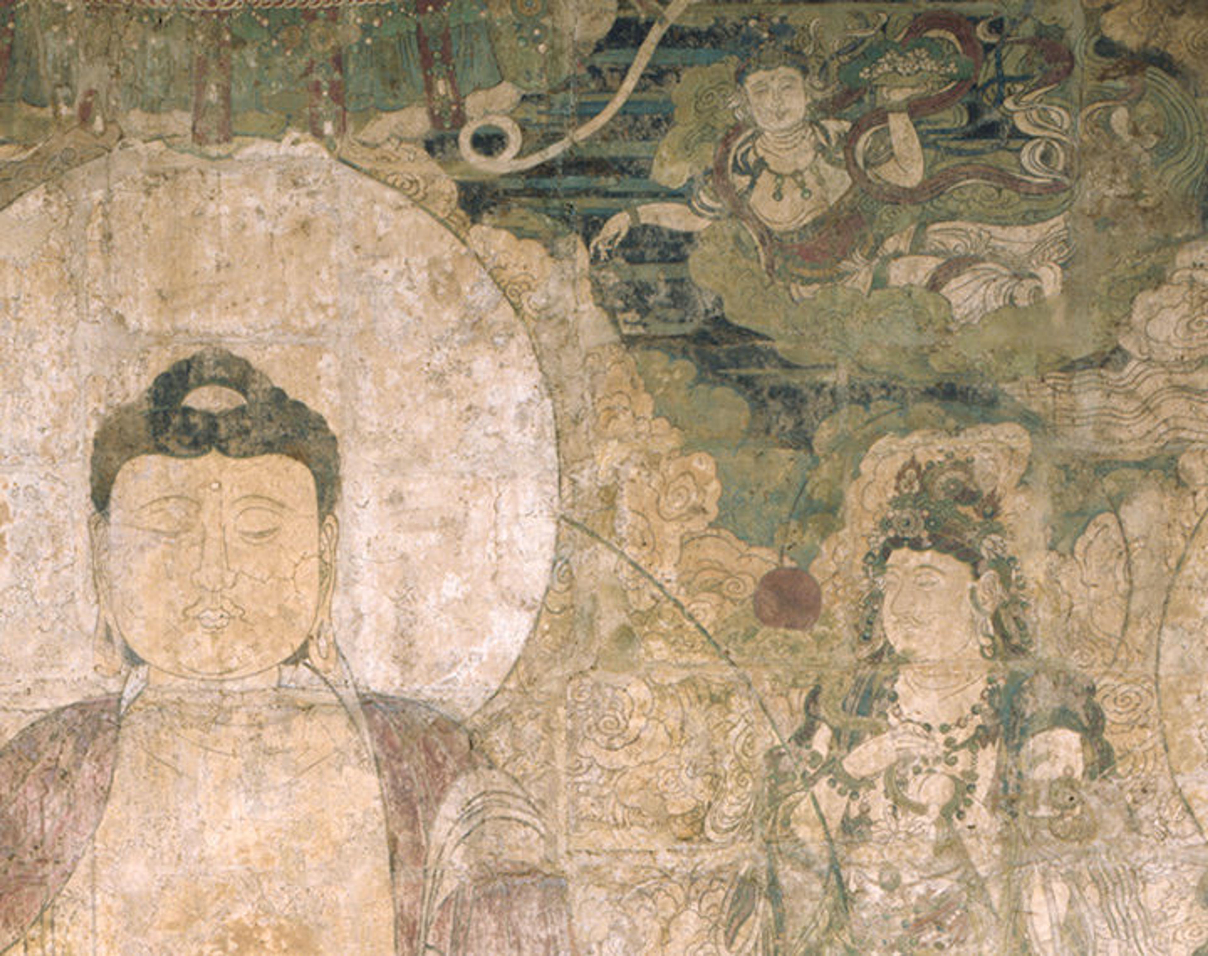Detail of the mural of the Buddha of Medicine showing his face and chest and deities in the sky.