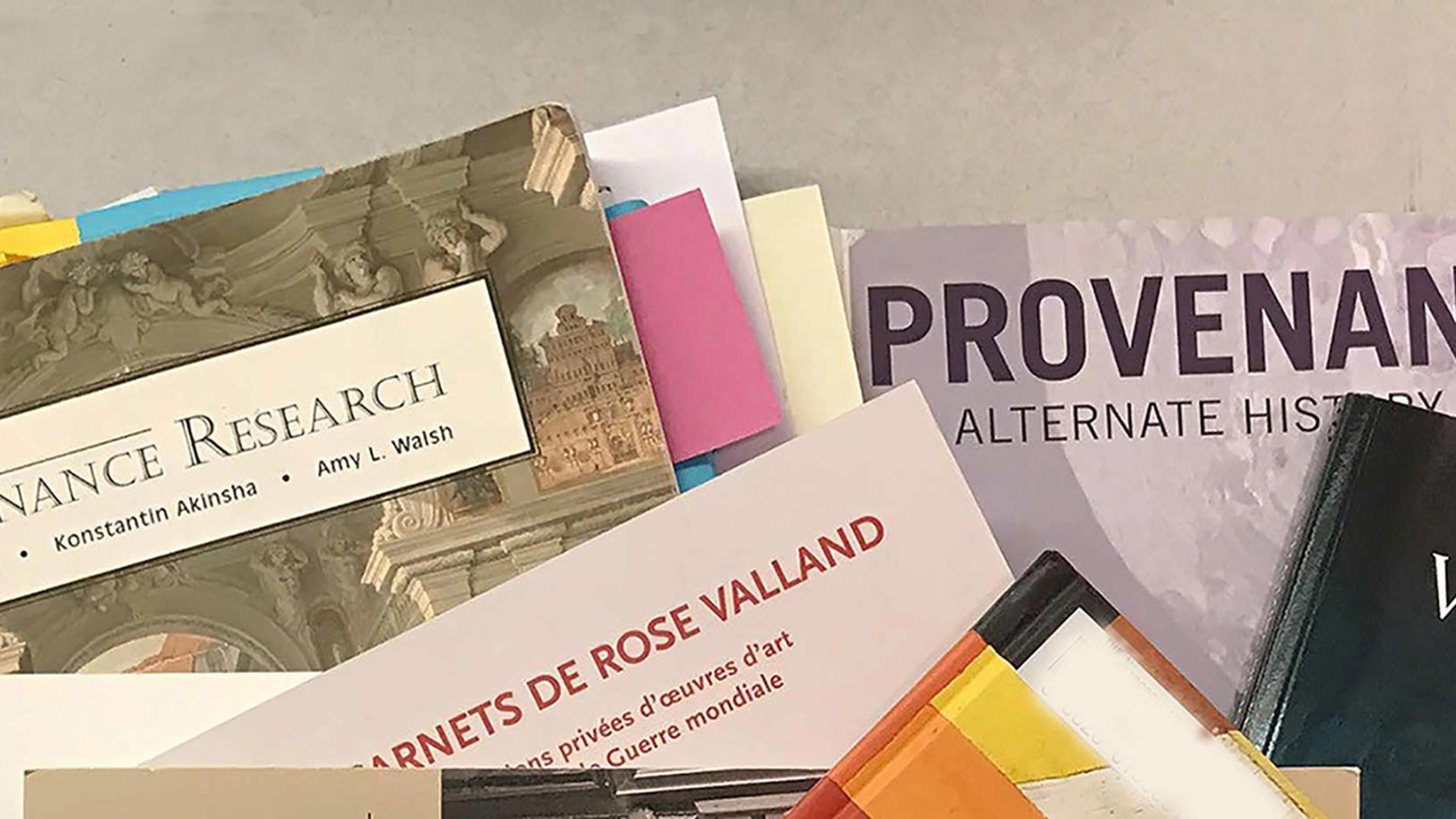 Color photograph of provenance research book covers.