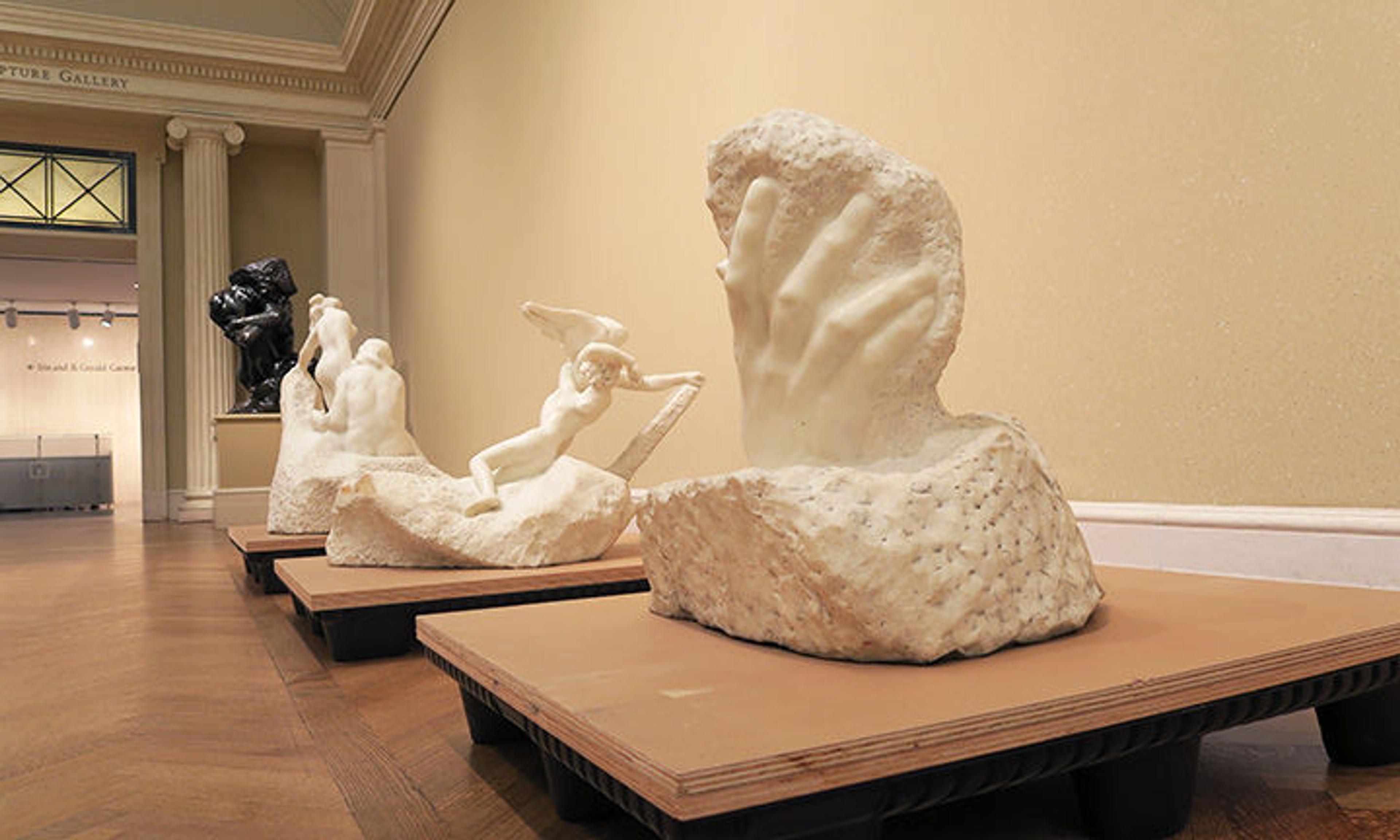 The Hand of God and other marble sculptures by Rodin lined up on pallets, ready for relocation.