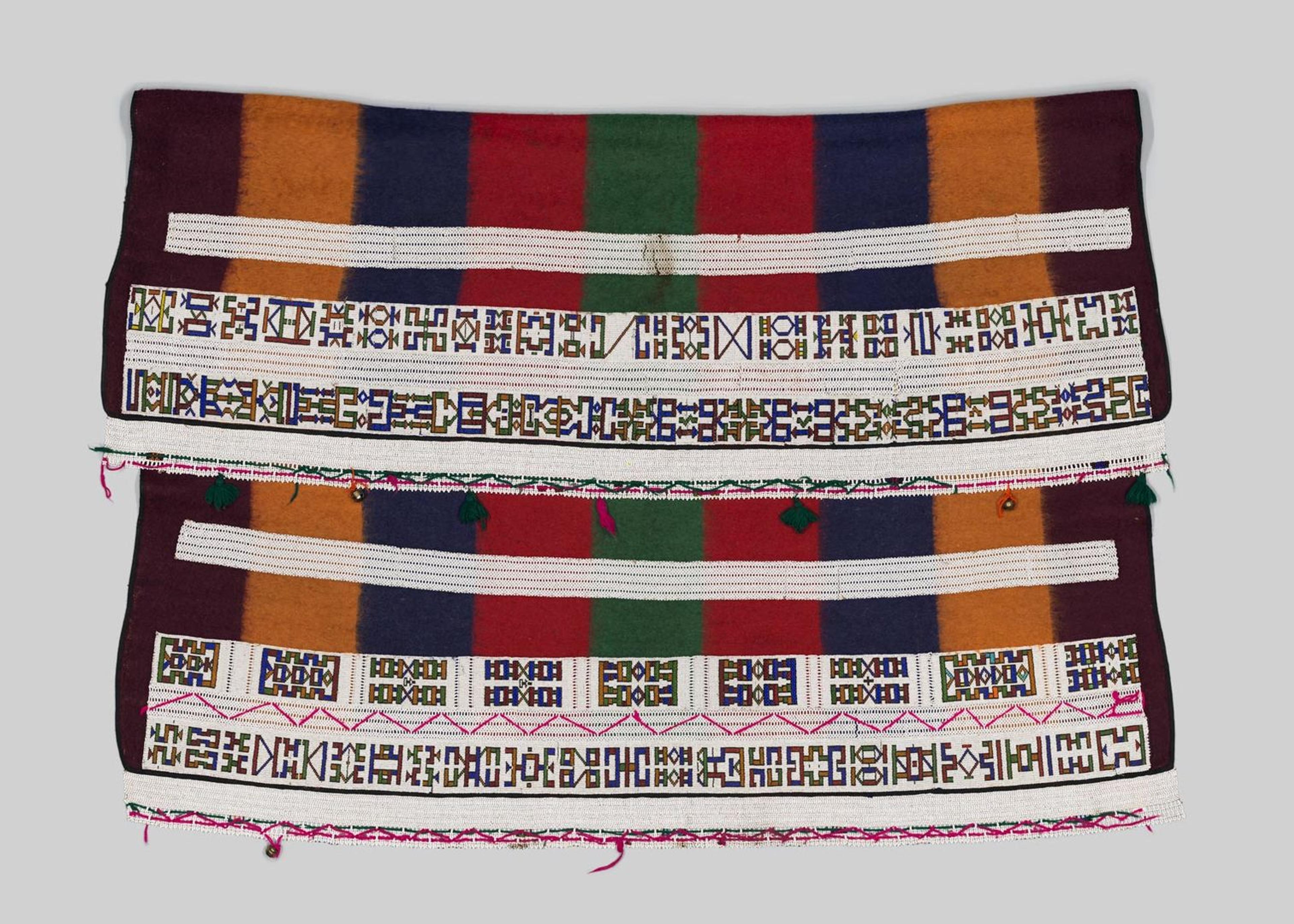 A woman's cape made by the Ndebele peoples of South Africa made of wool, glass beads, and brass bells