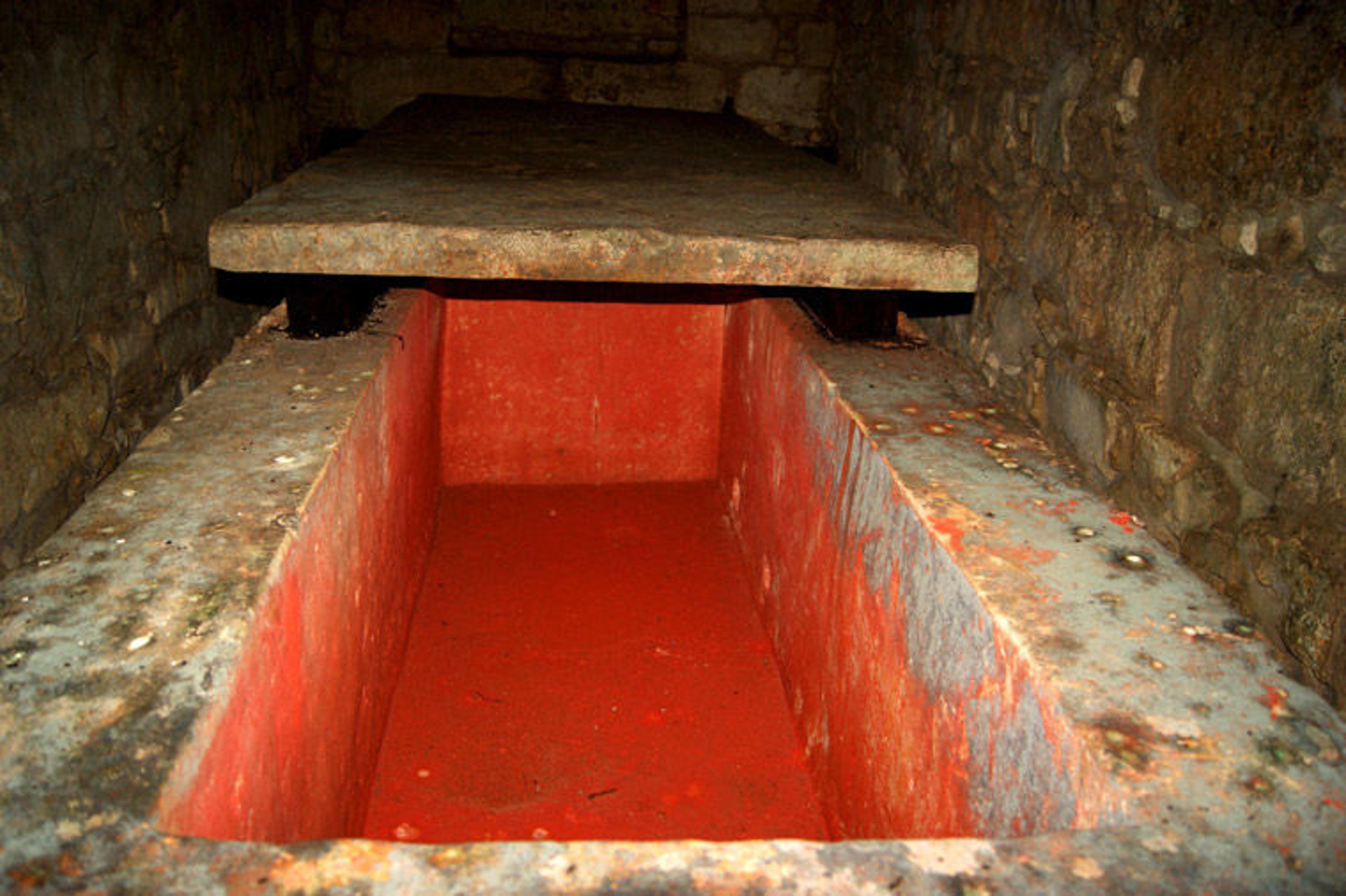 Modern-day photo of the sarcophagus of the 'Red Queen' in Mexico, showing the area lined with crimson cinnabar
