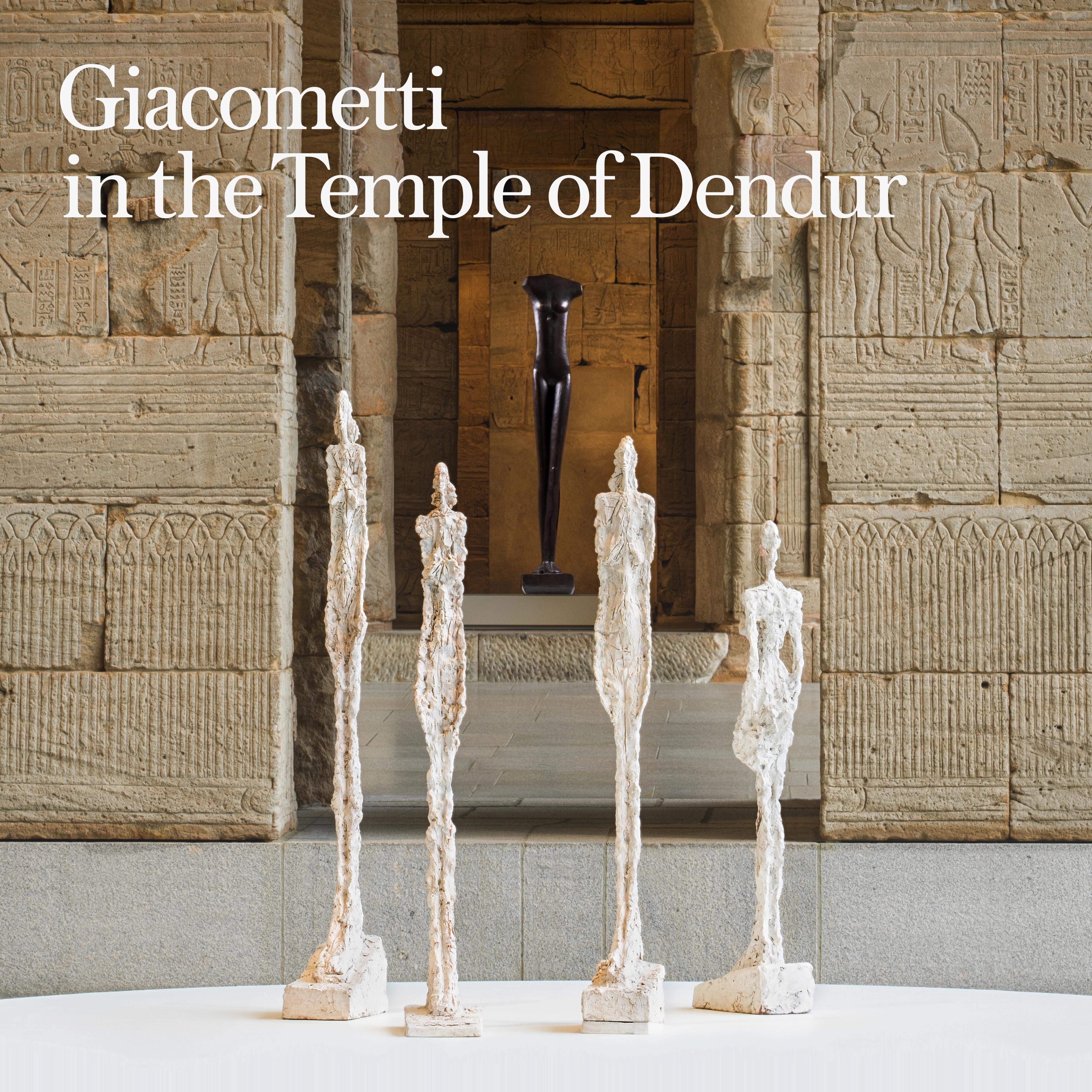 Tall, slender sculpture by Giacometti stands against a dark teal background. Text reads "Giacometti in the Temple of Dendur," suggesting an exhibit.