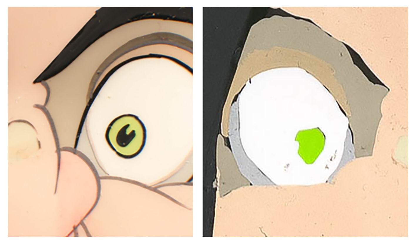 A detail of an eyeball of a menacing face, front and back.