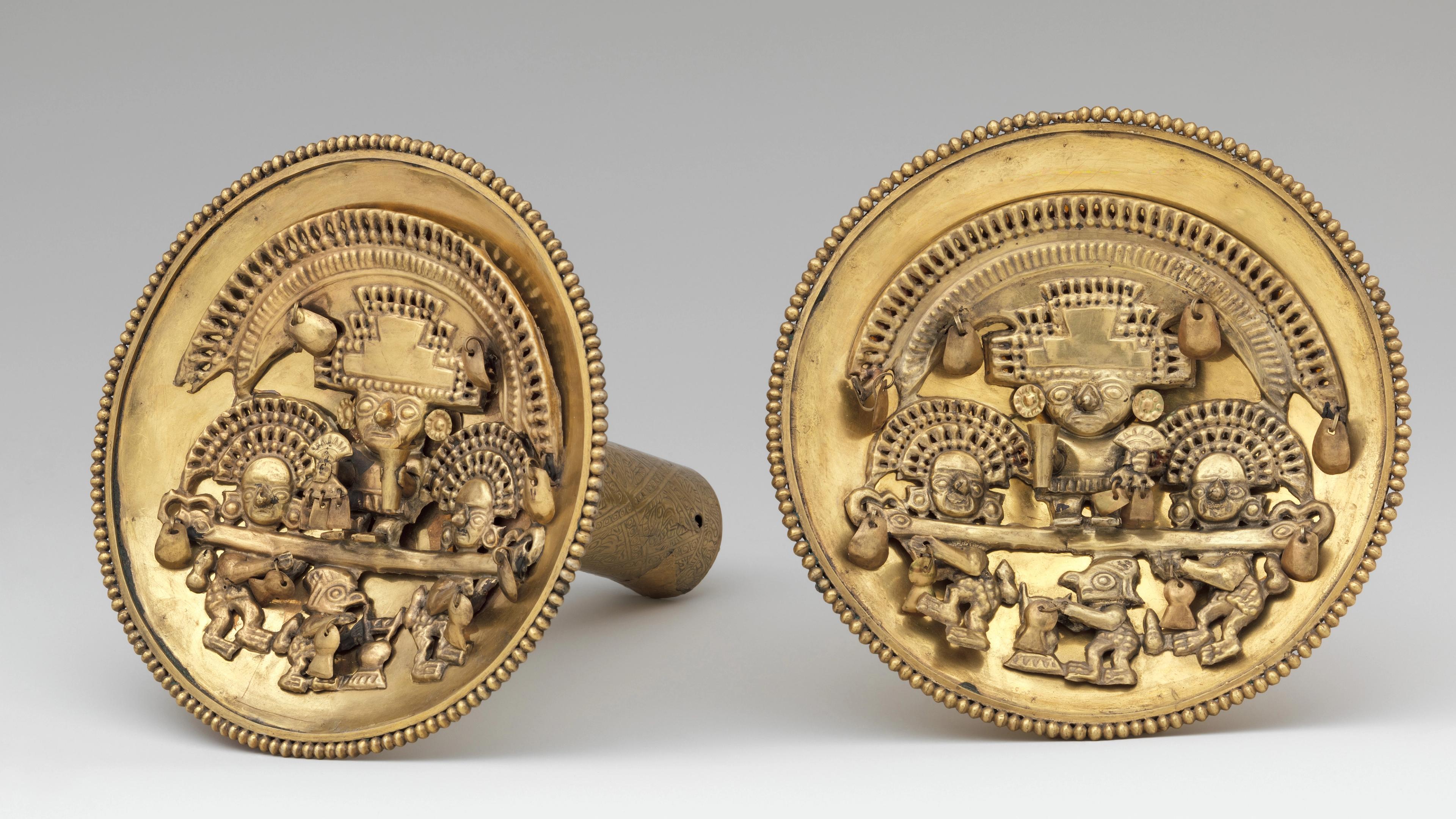 Pair of gold earflares with multifigure scenes