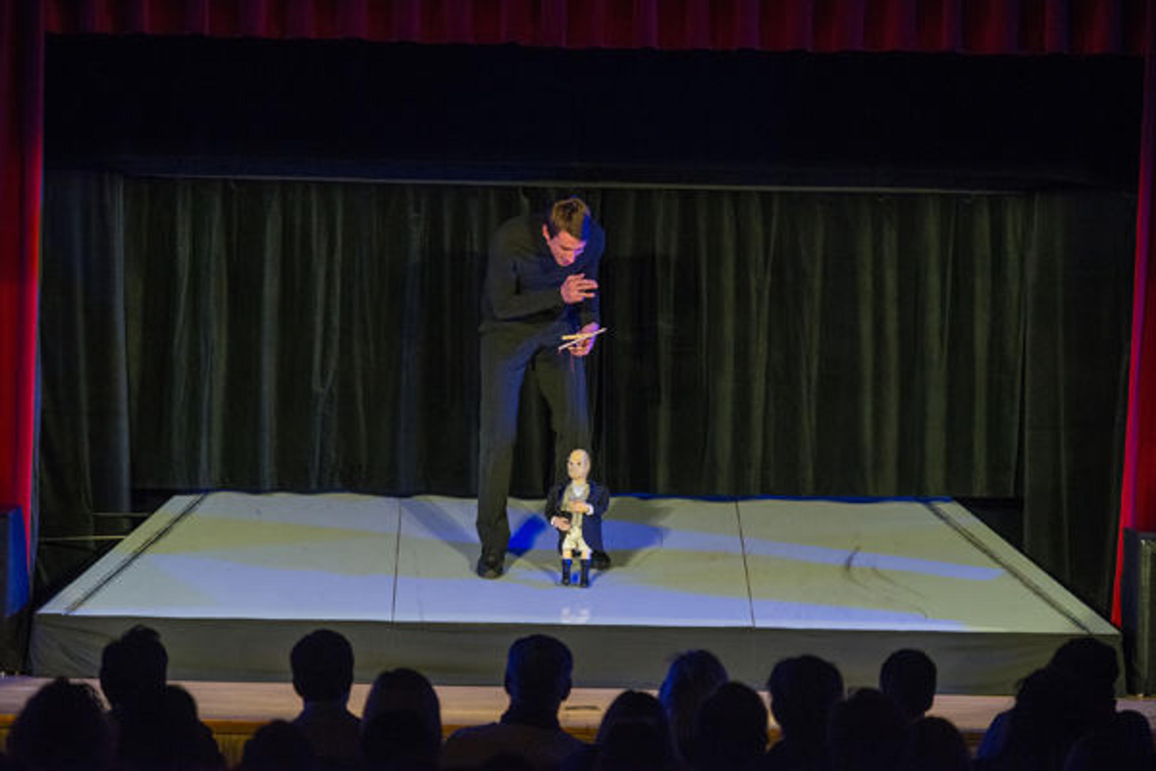Performer and marionette on stage during the Ring Cycle. Photo by Stephanie Berger