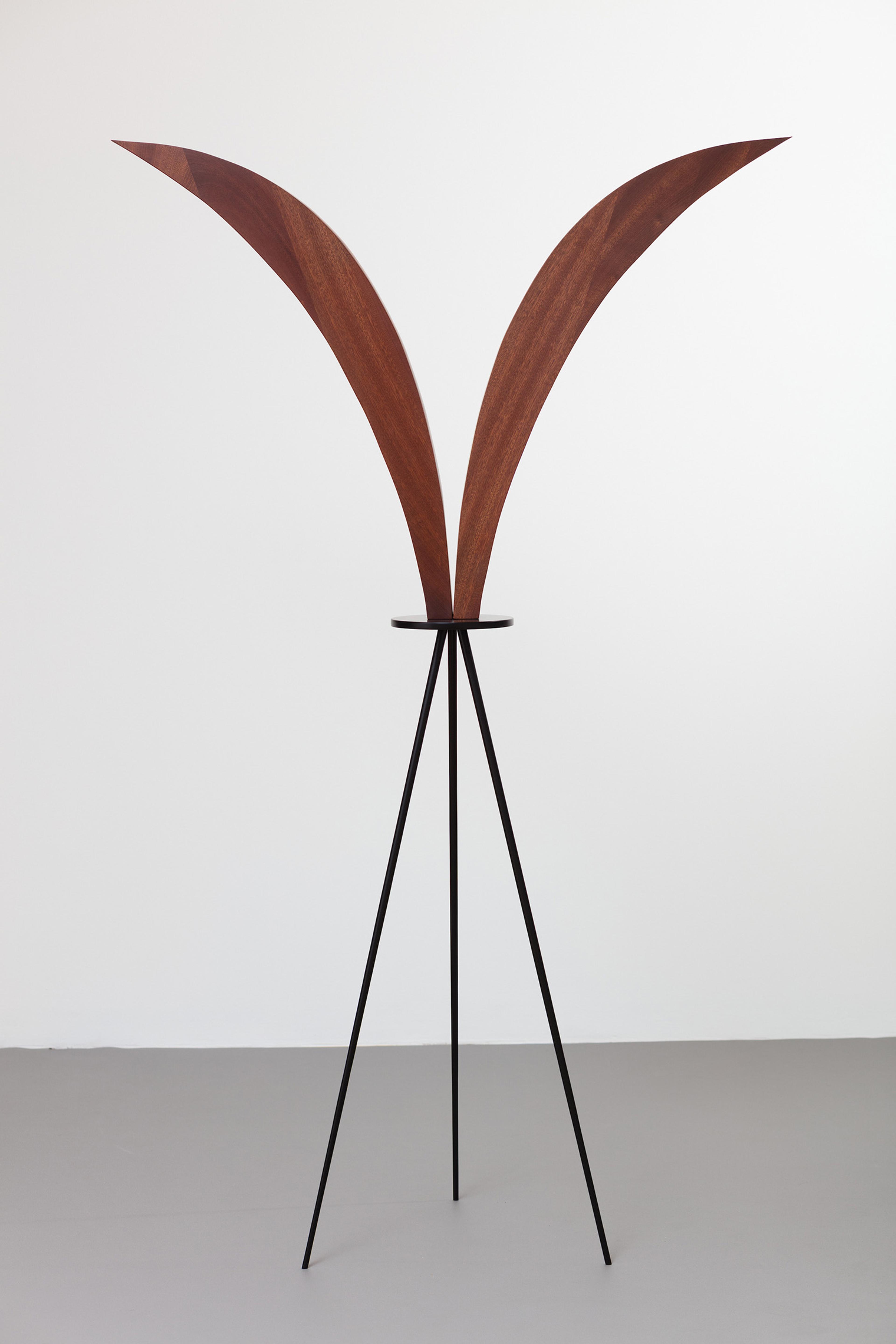 Standing wooden carved object.