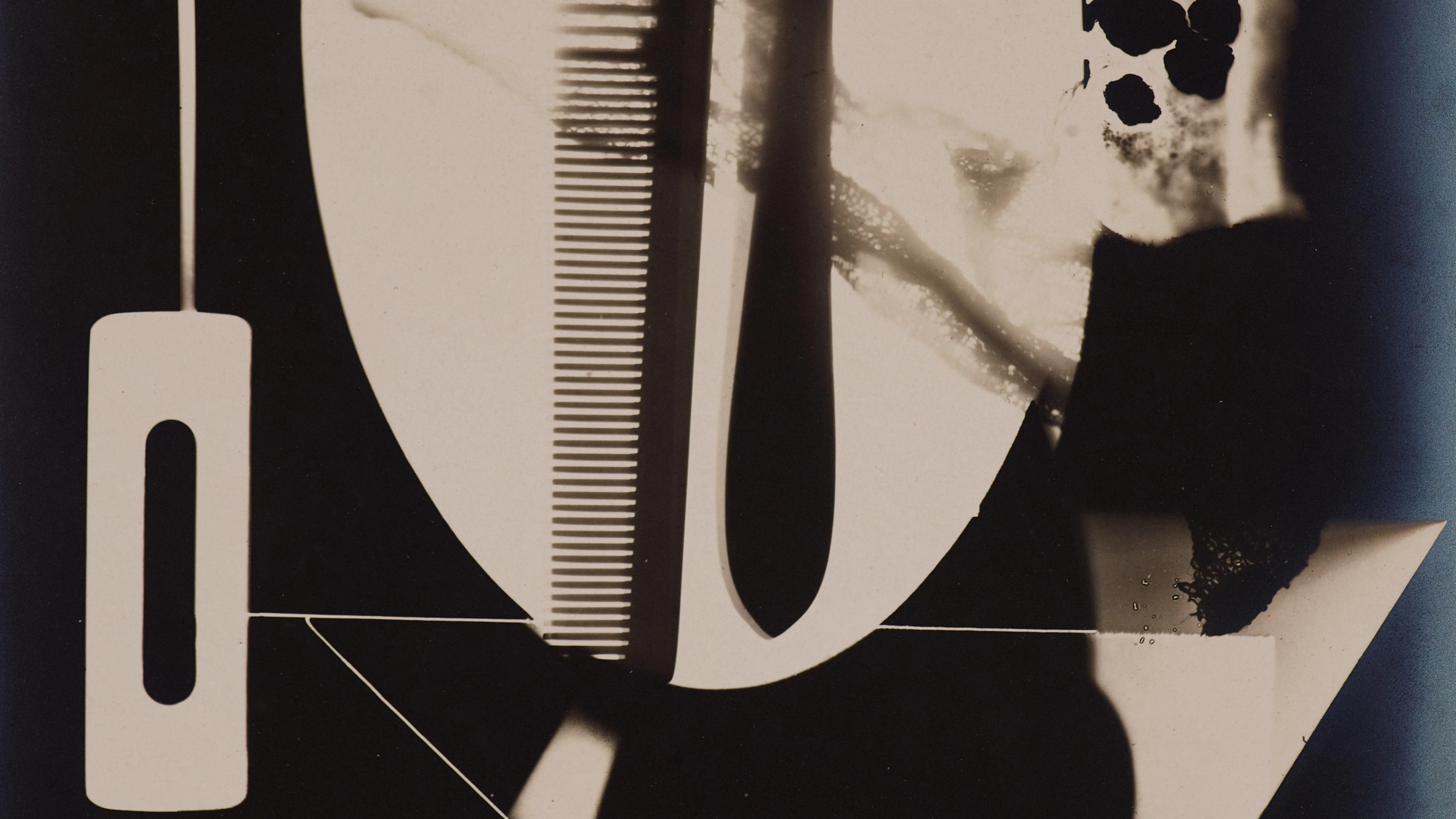 Abstract photogram with overlapping shapes, including a comb and geometric patterns, creating a surreal, monochromatic composition. Bold and mysterious.
