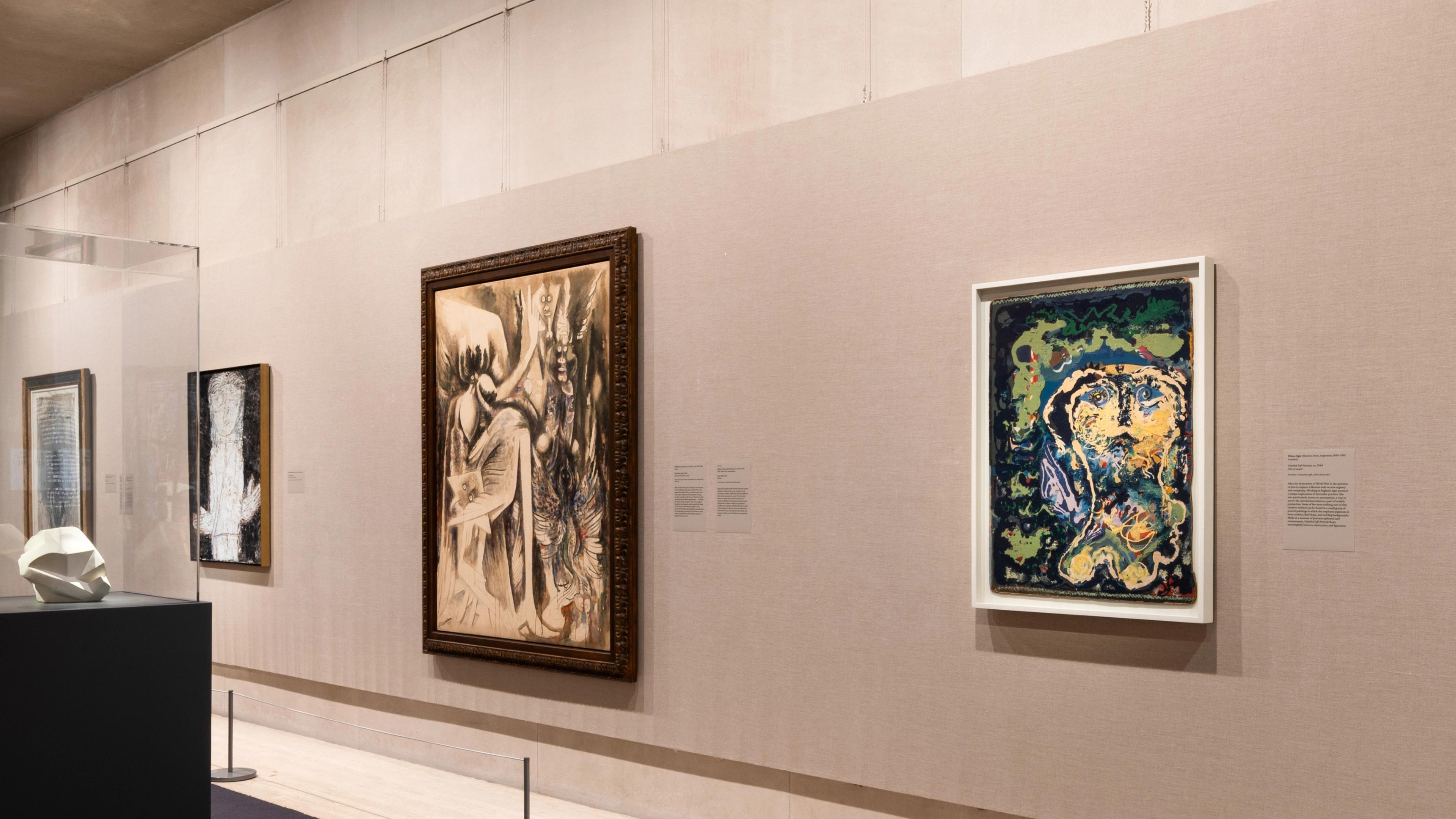 In gallery view with painting hanging on the wall