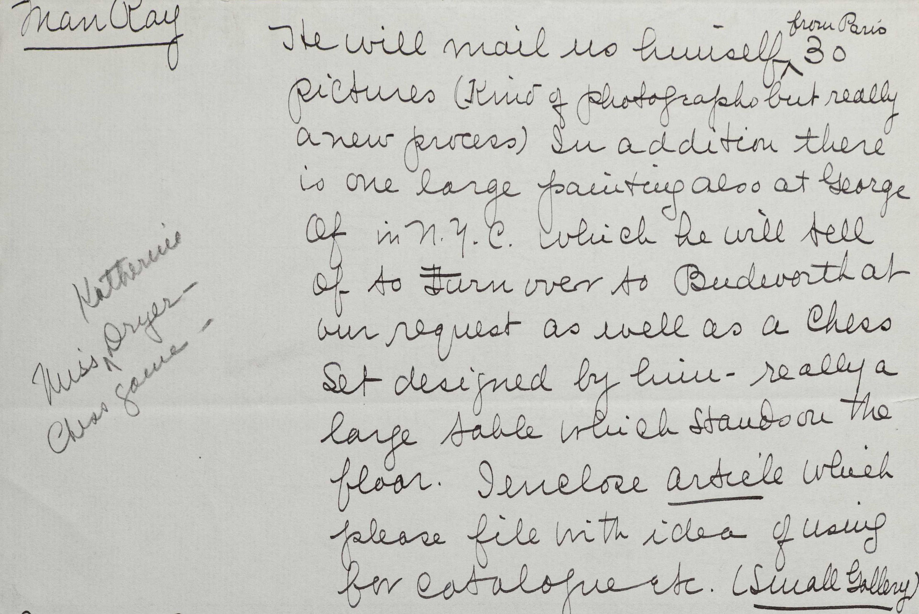Paper with handwritten text in script that fills the right side. "Man Ray" in underline appears at the top left.