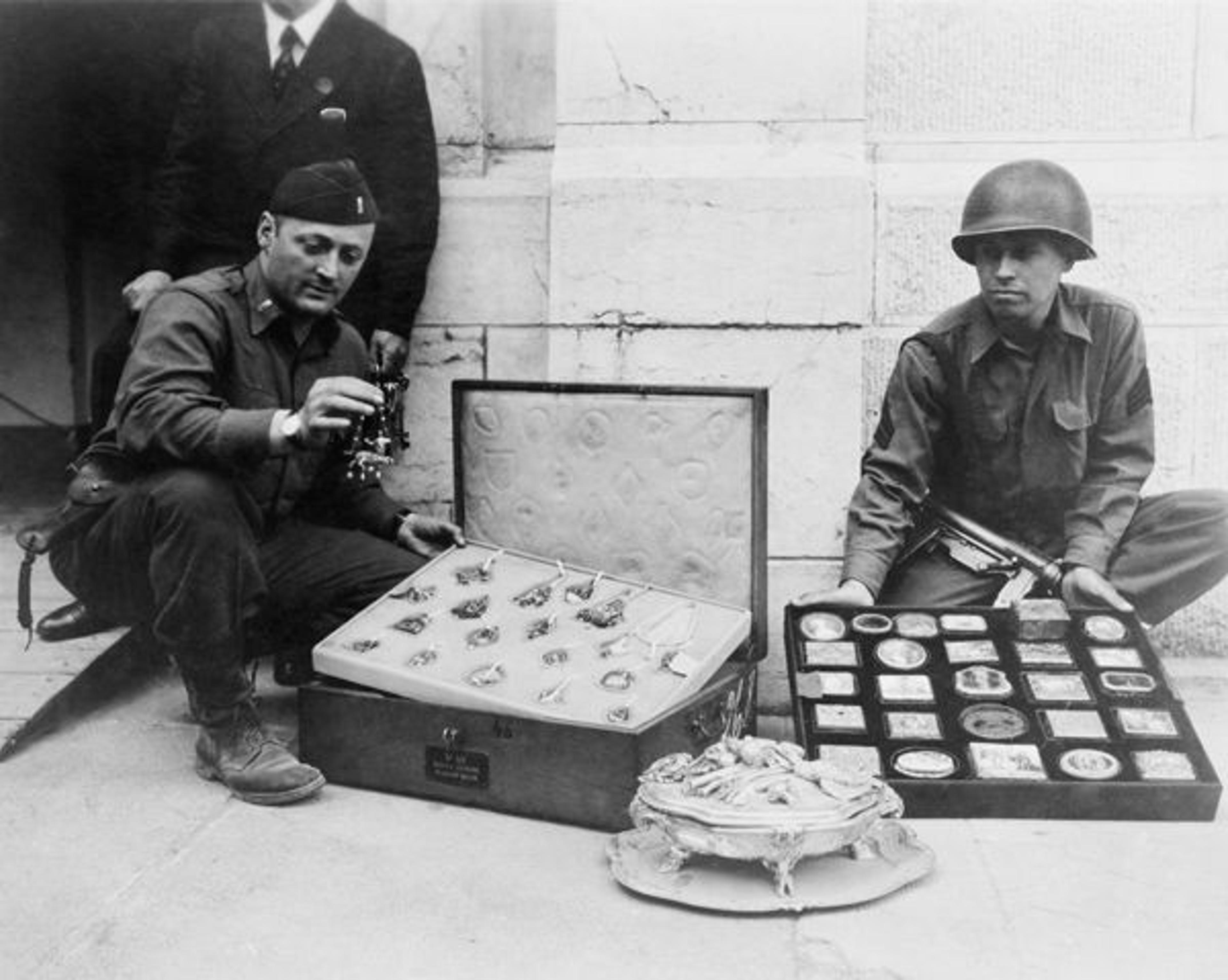 James Rorimer with Sgt. Antonio T. Valin examining recovered objects. Neuschwanstein, Germany, May 1945