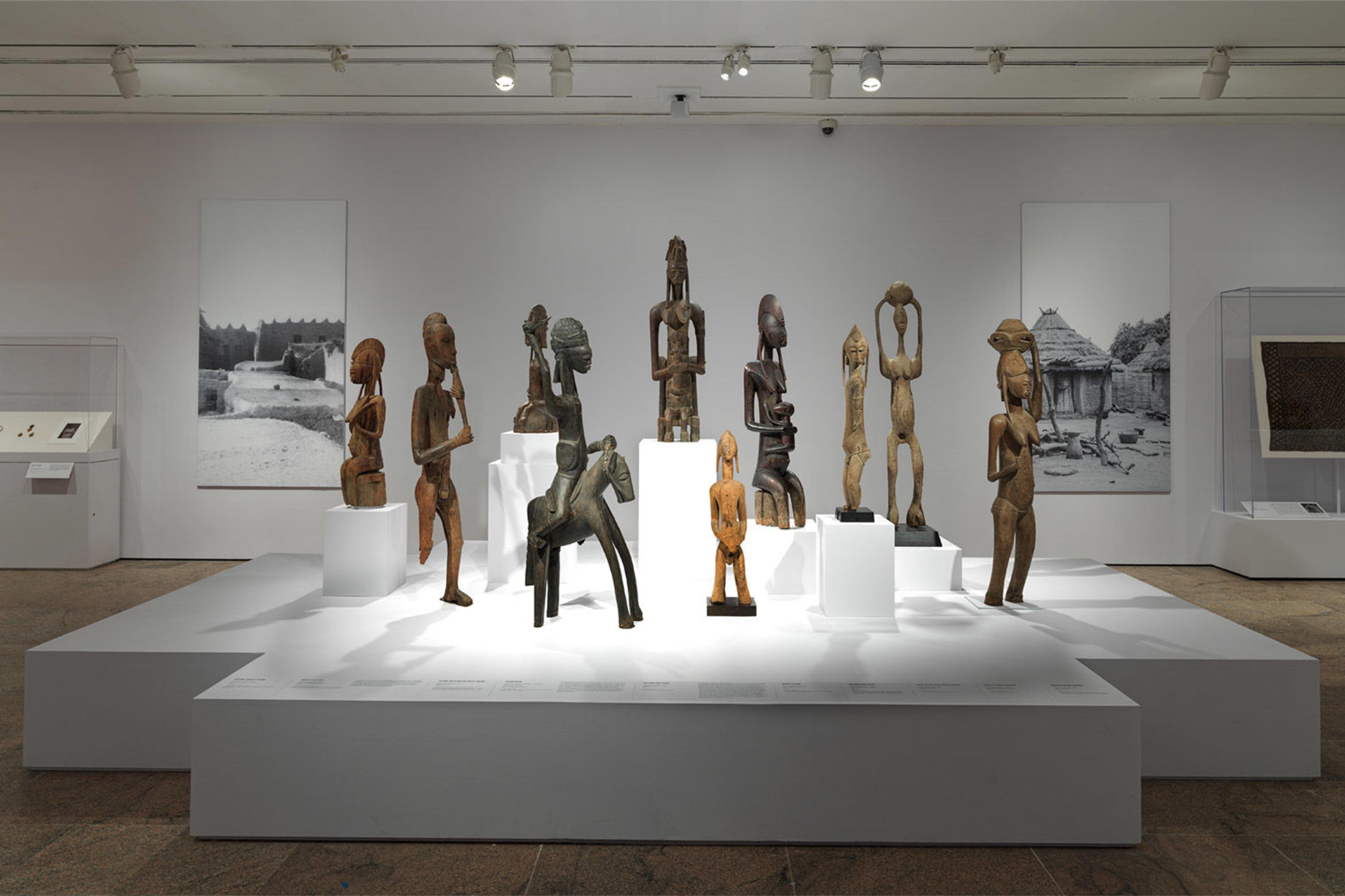 A gallery displaying a number of terracotta and wooden sculptures