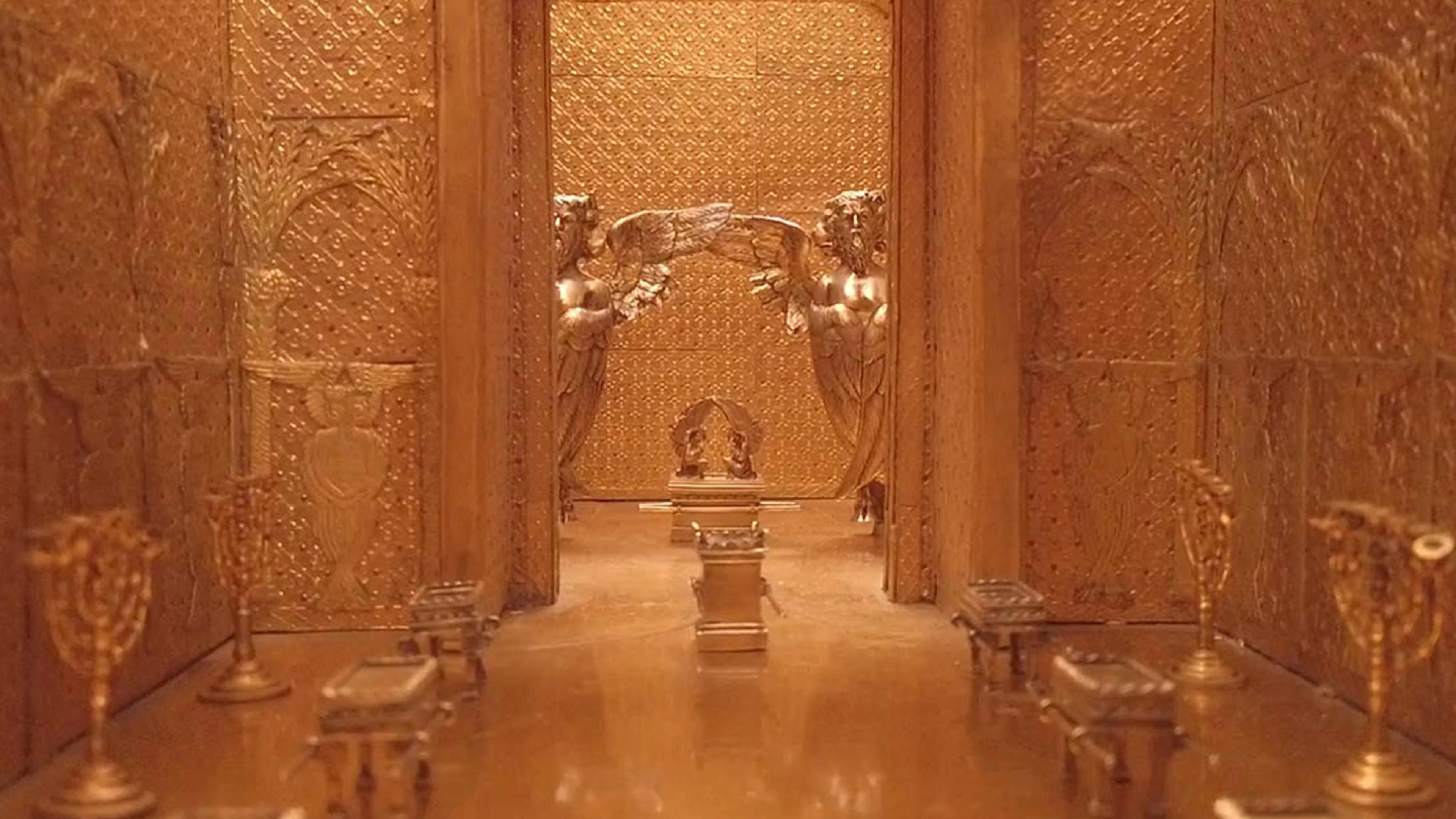 A golden hallway from an architectural model of an ancient temple.