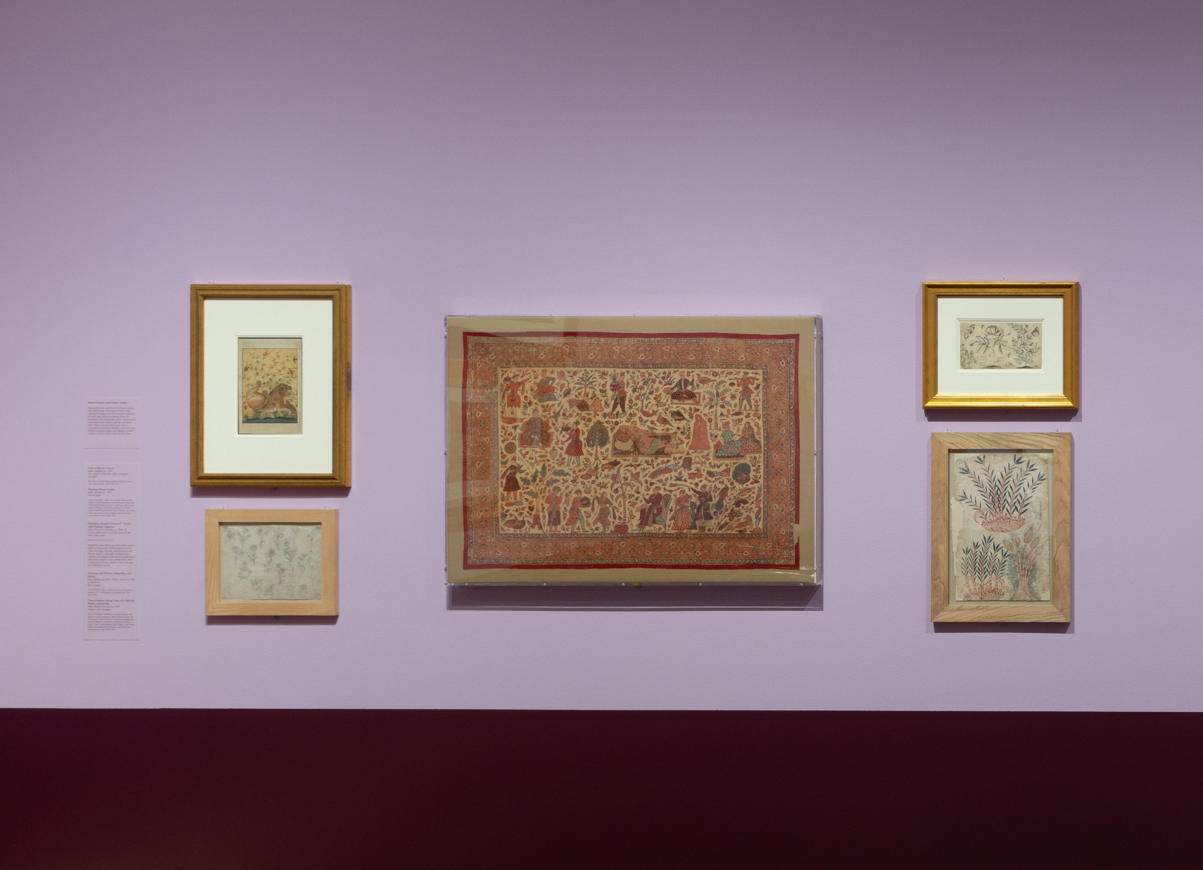 An art gallery room with purple walls displays framed historical paintings. The pieces are varied in size, and a glass display case is partially visible.