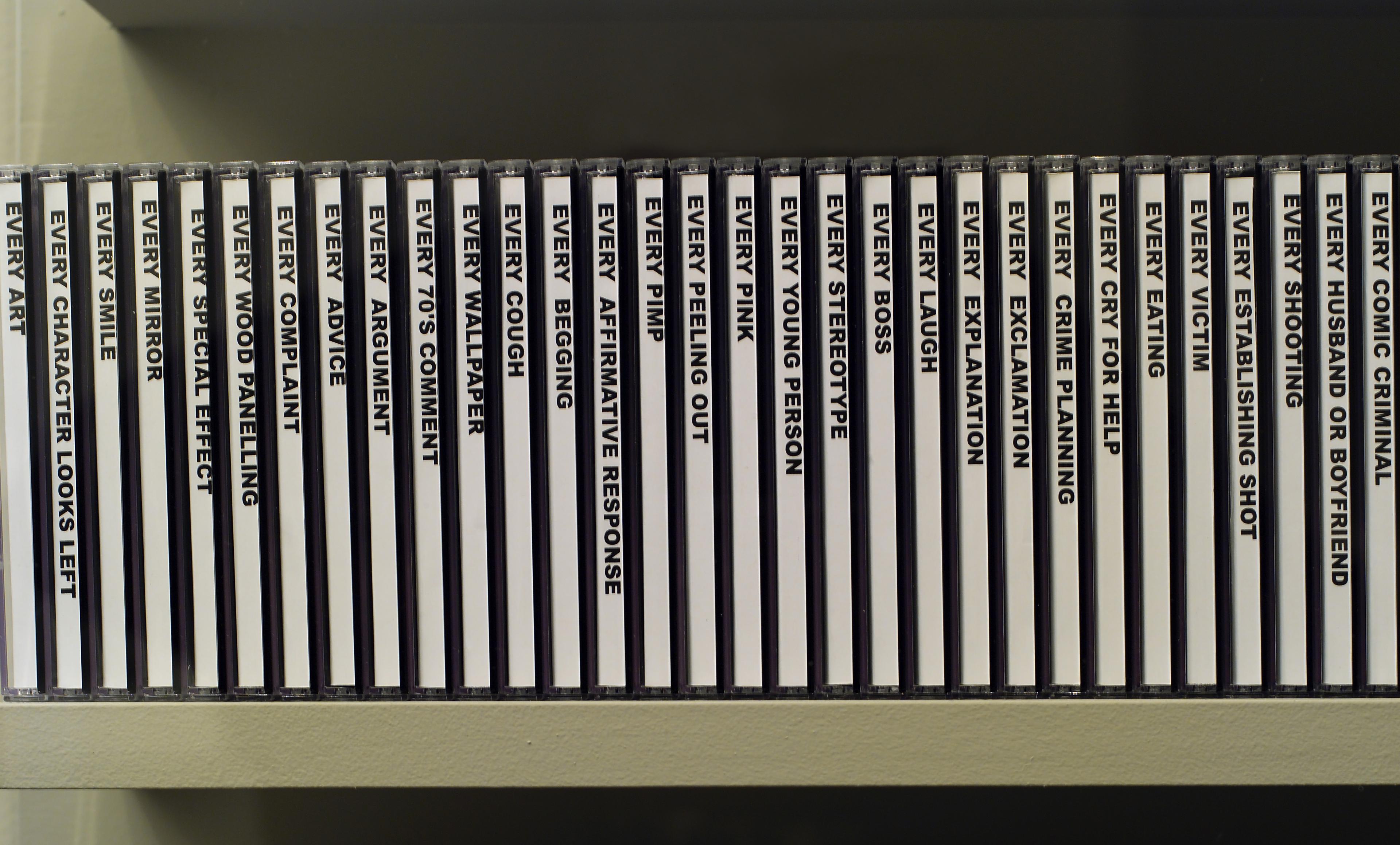 Row of CDs on a shelf. Bold black text against the white spines reads "EVERY..."