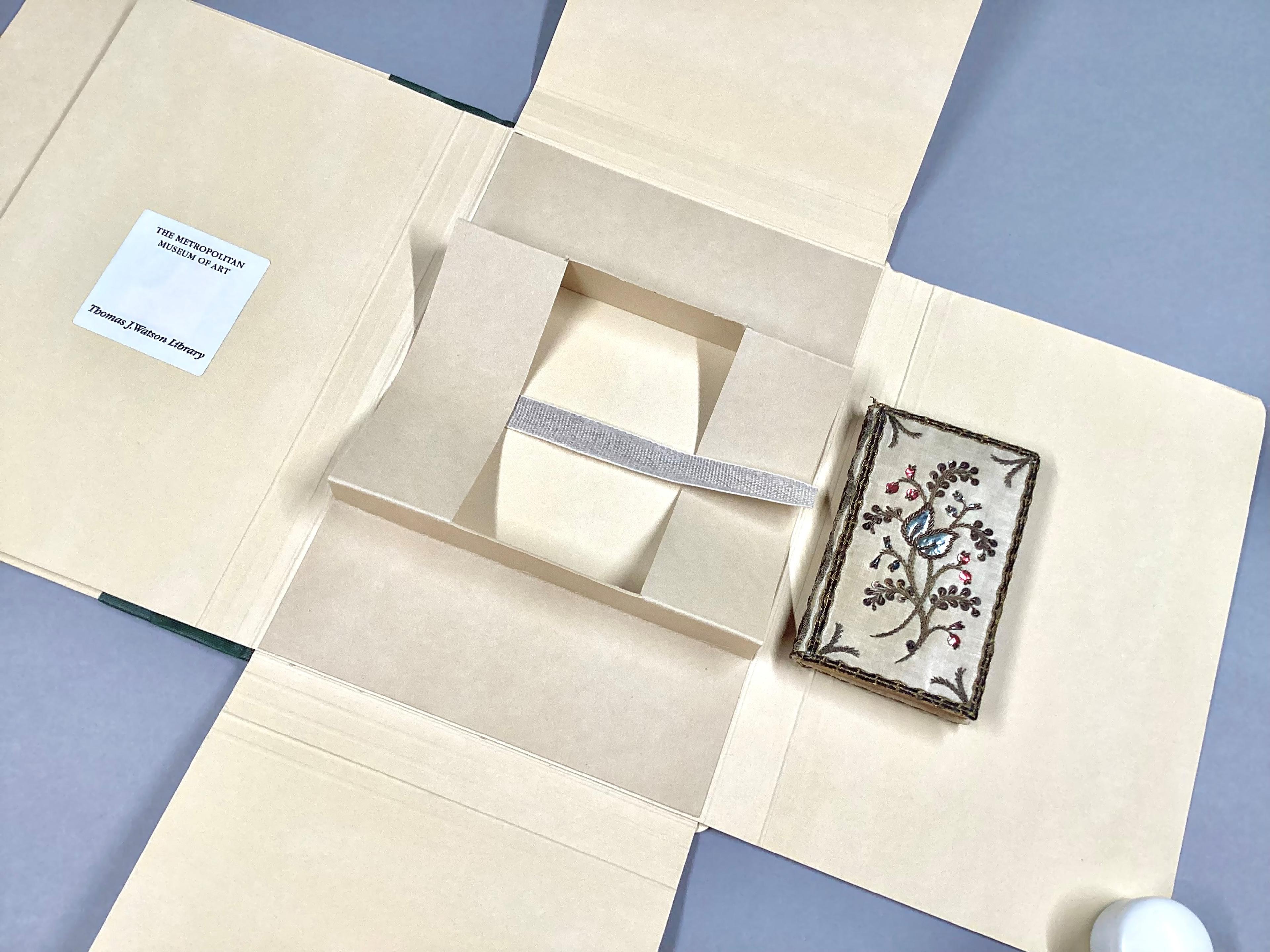 Book cradle within a library box