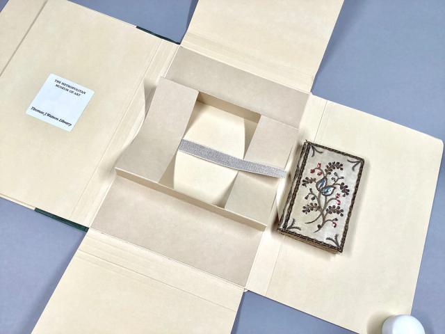 Book cradle within a library box