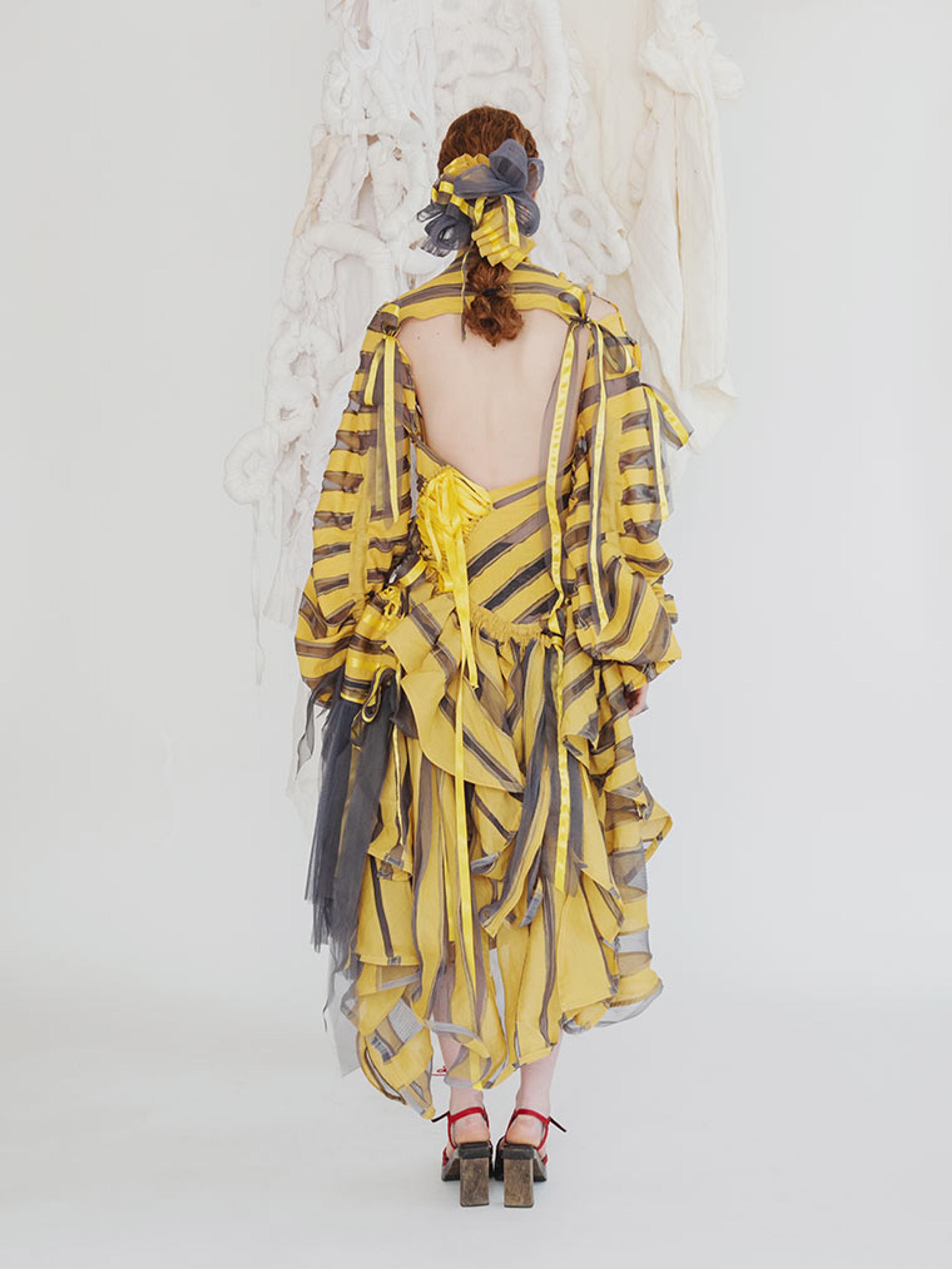 Aurora Wilkinson's yellow and black striped dress seen from the back