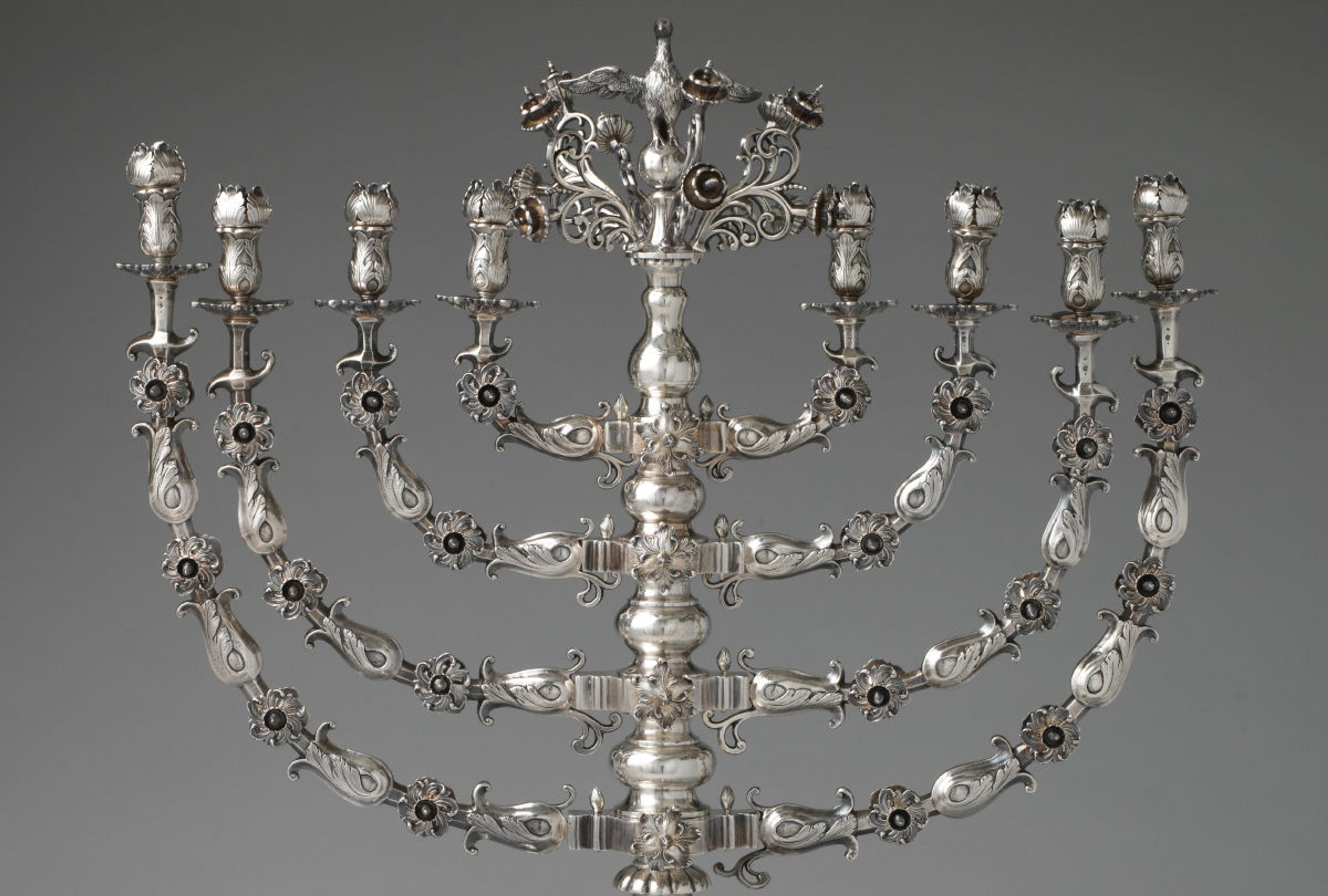 a close-up of an ornate silver menorah.