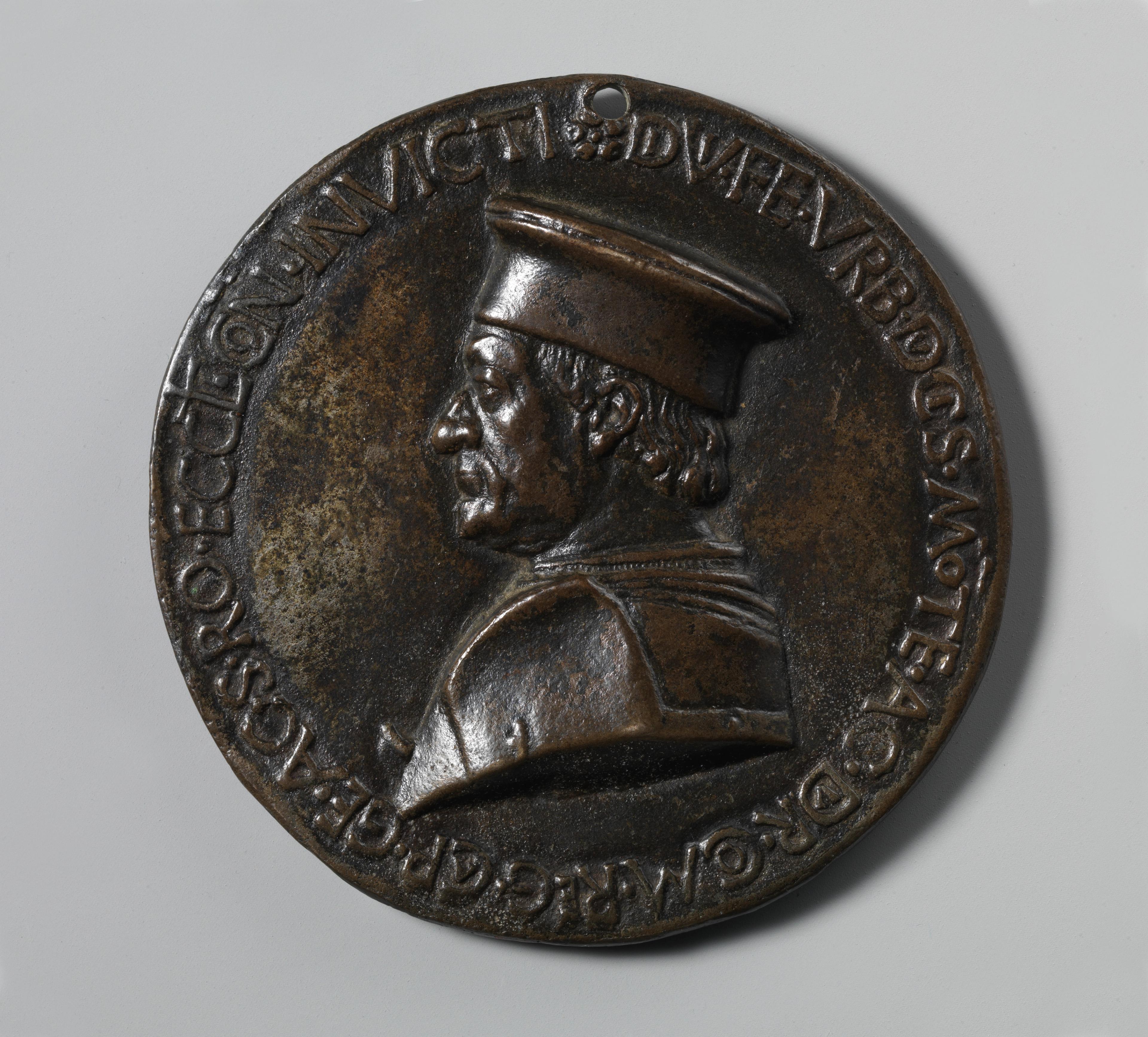 Bronze coin with the left profile of a man in a flat-topped hat.