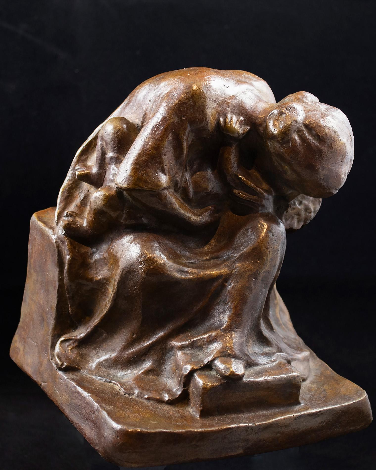 Bronze sculpture of a seated woman in a contemplative pose, with a shawl over her head. Her form is rounded and textured.